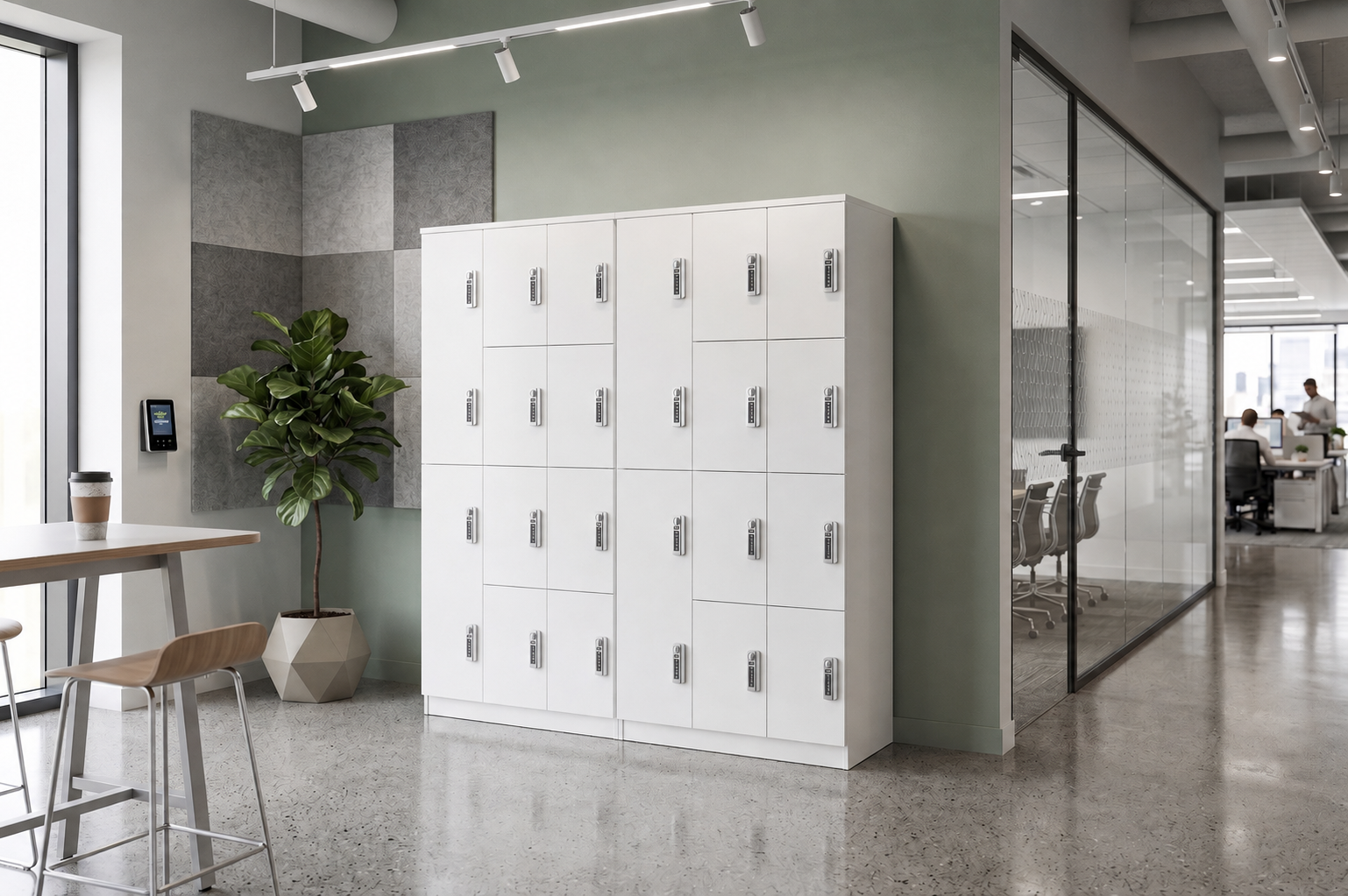 Modern office break room with white lockers, a potted plant, a small table with a latte, and glass-walled conference rooms with people working inside.