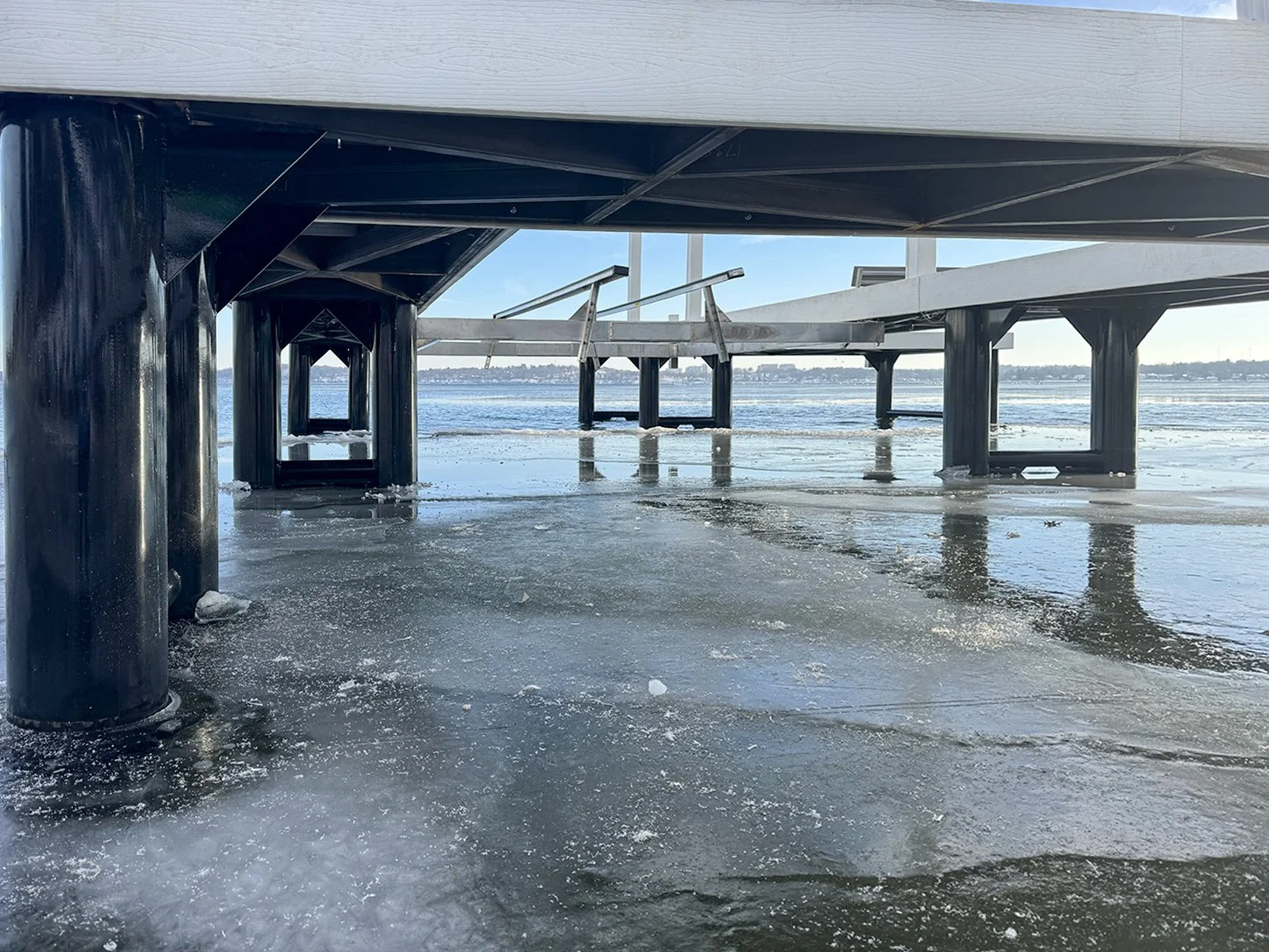 Steel pipe pilings supporting a Lifetime All Seasons HD Pier during winter conditions