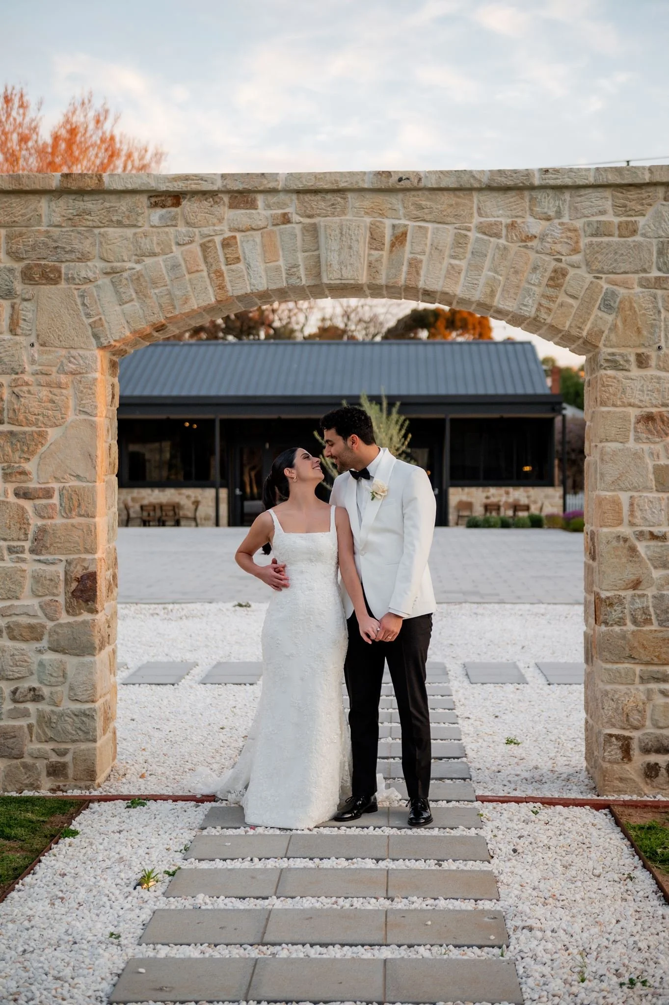 Wedding couple under the stone archway at Sunnybrae Estate, Regency Park