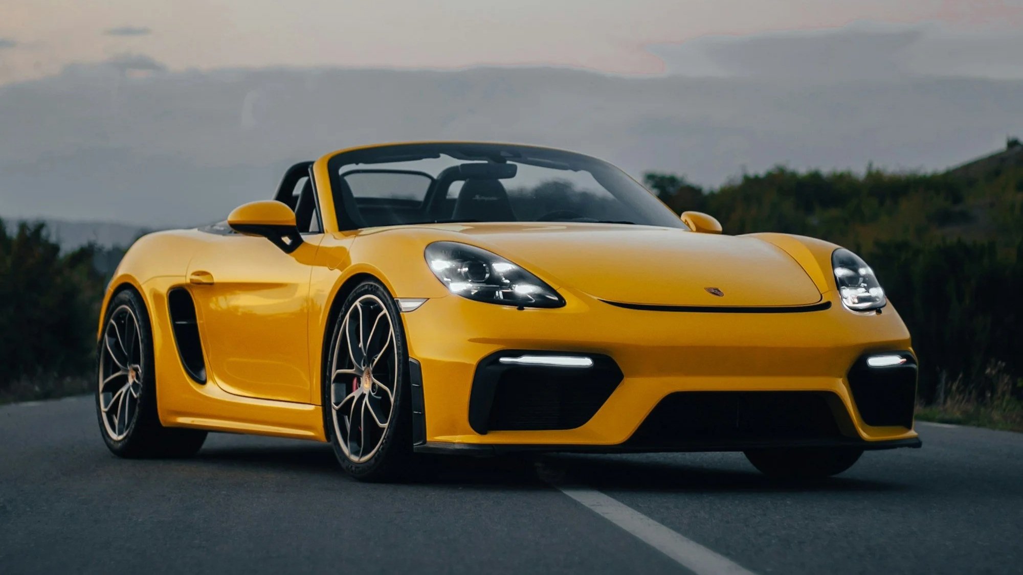 Yellow sports car parked on the side of the road, featured in a semi‑annual car care package by Alex’s Mobile Car Detailing in Everett, Washington.