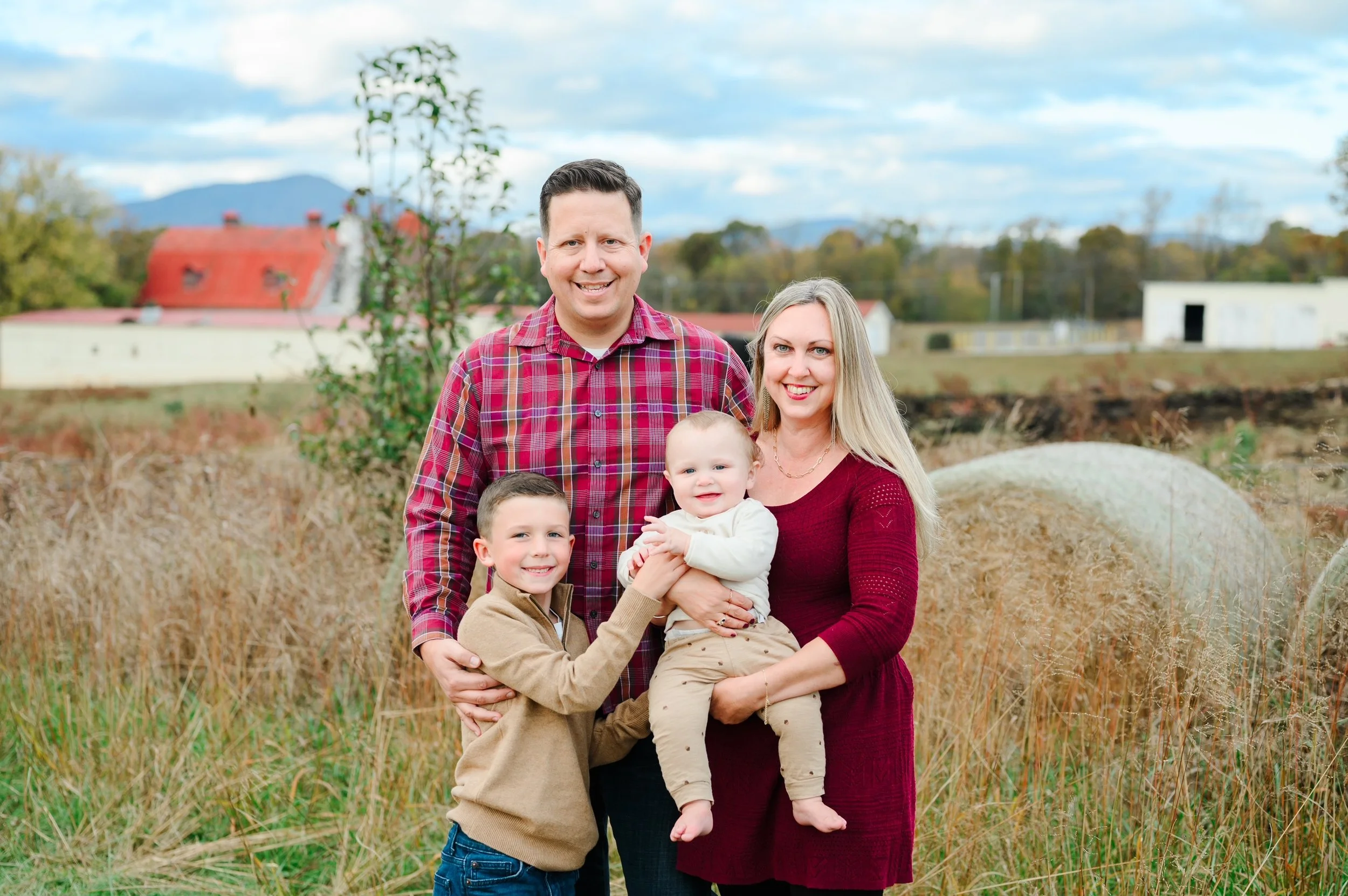 Matthew and Robin with their two sons in a fall setting
