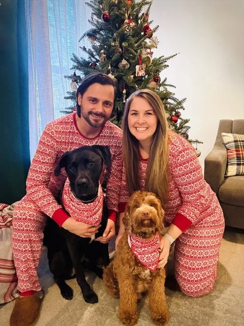 David and Rebekah with their two dogs in matching pajamas
