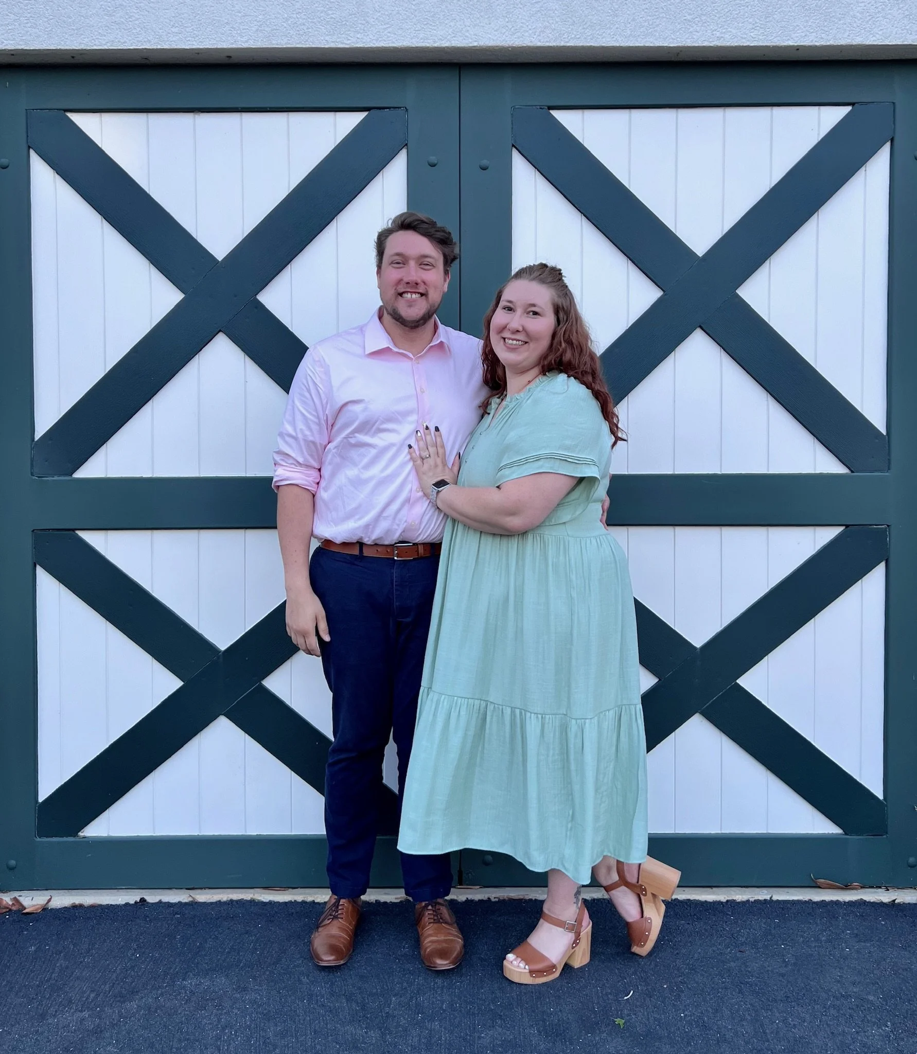Sam and Becca in front of a barn door