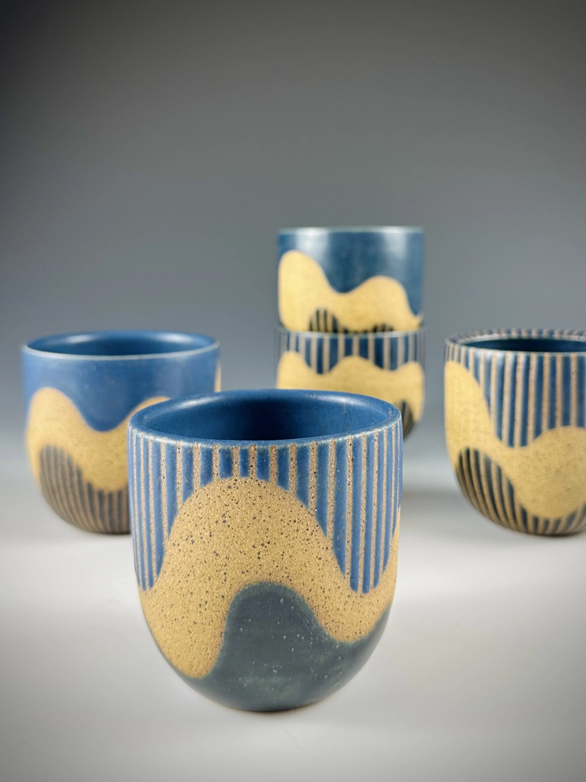 Taped wavy cups by Judith Yeo