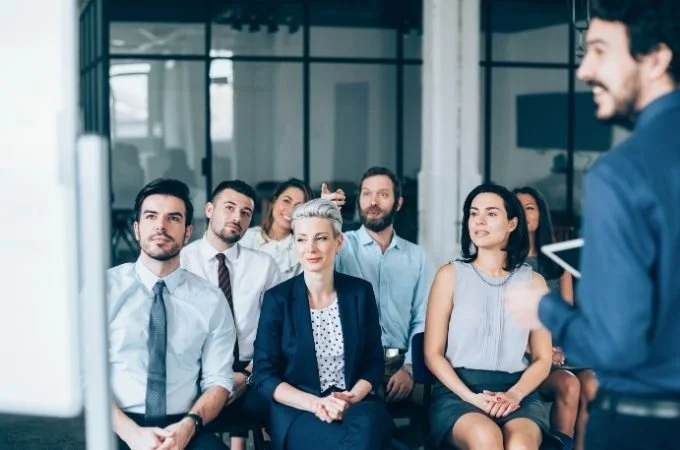 Smiling couple holding certificates