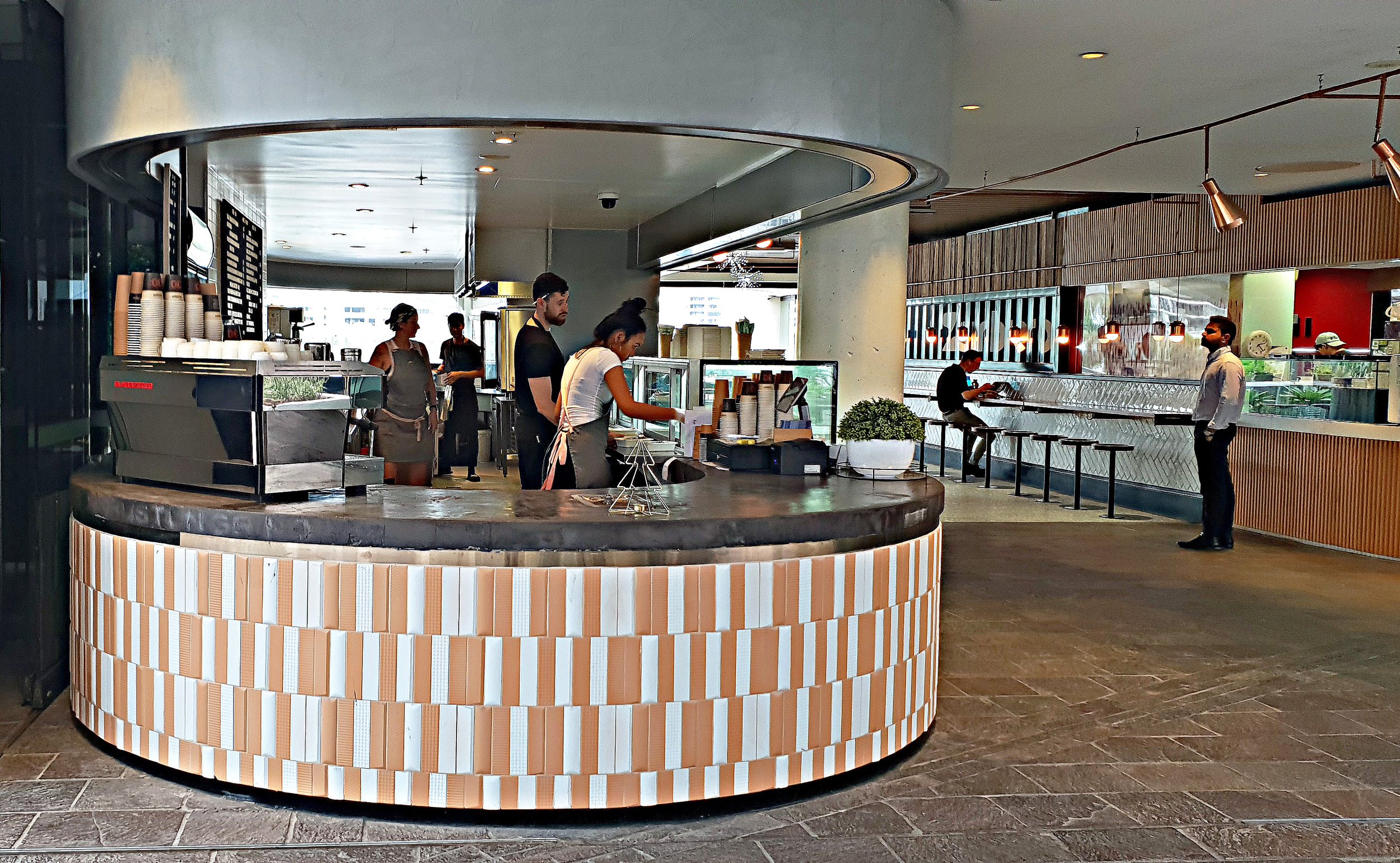 Hustl N Grind Café | Circular Café Counter Design | Workplace Hospitality Fitout Brisbane

This Hustl N Grind Café fitout features a contemporary circular café counter designed for a modern workplace hospitality environment. A polished concrete count
