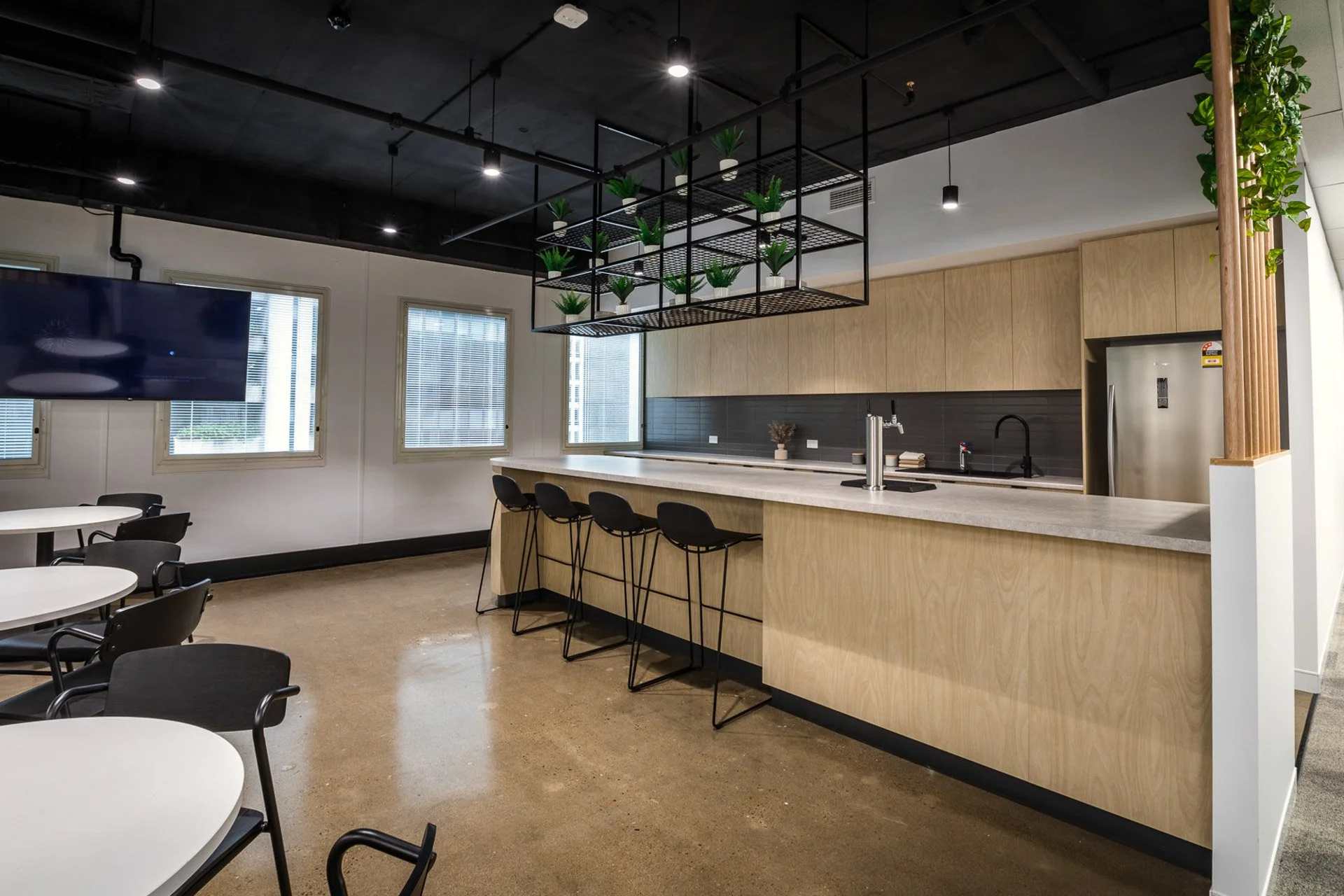 Premise Office Fitout | Workplace Kitchen & Breakout Space Design Brisbane

This Premise office fitout features a contemporary workplace kitchen and breakout space designed to support collaboration, connection, and workplace functionality. Natural ti