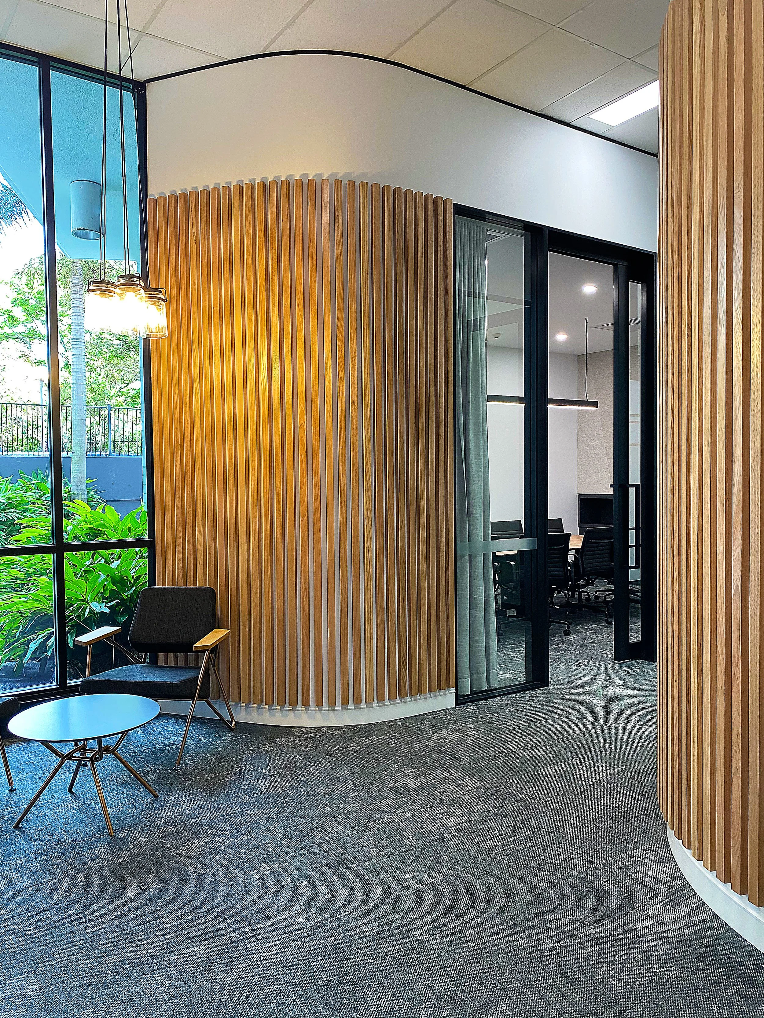 Copper Mountain Mining Office Fitout | Timber Batten Feature Wall & Workplace Design Brisbane

This Copper Mountain Mining office fitout features a contemporary workplace environment defined by curved timber batten walls, floor-to-ceiling glazing, an