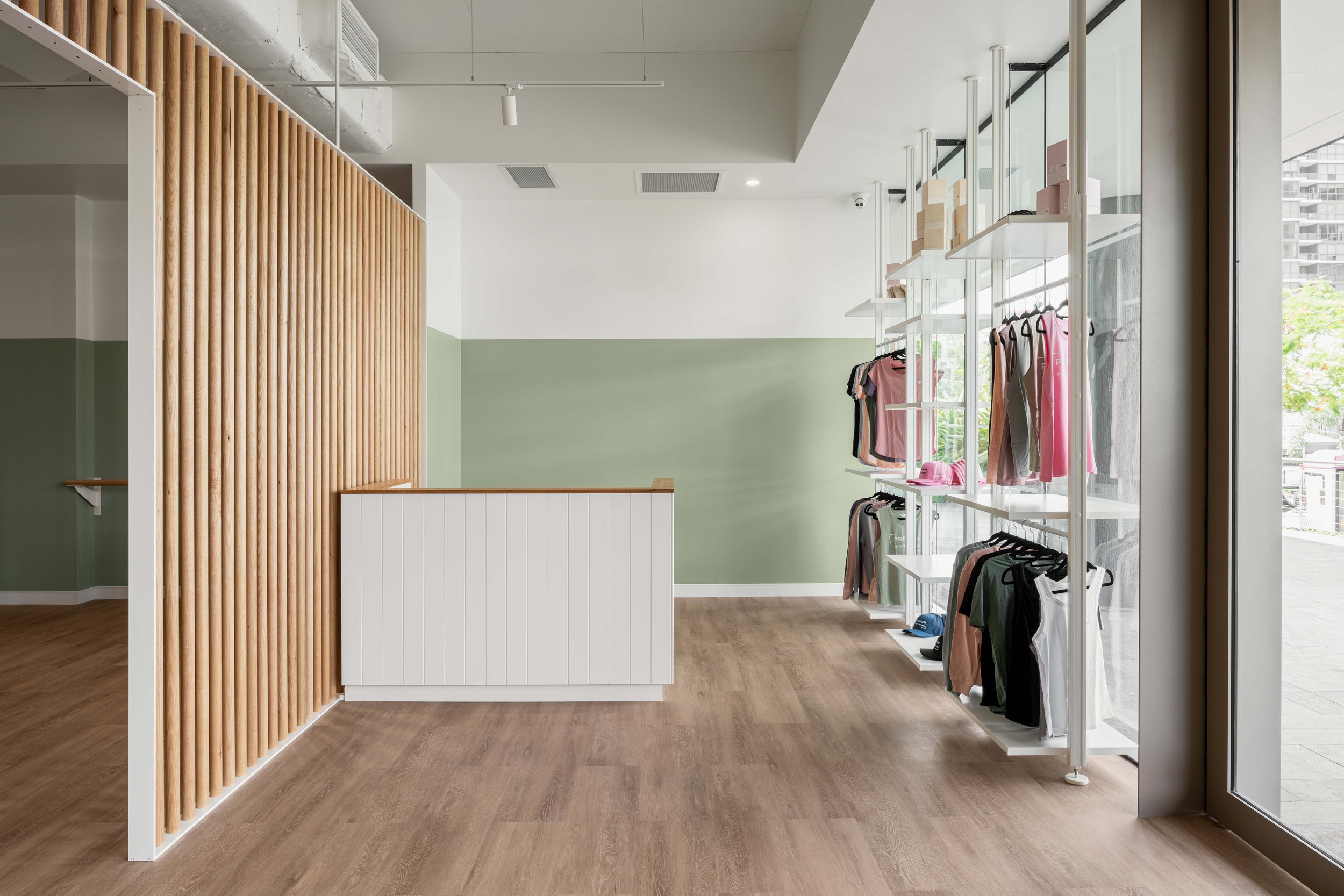 Premium Pilates Milton | Reception & Retail Interior Design Brisbane

This Premium Pilates Milton fitout features a welcoming reception and retail space designed to enhance the client experience. Soft sage green walls, warm timber finishes, minimalis