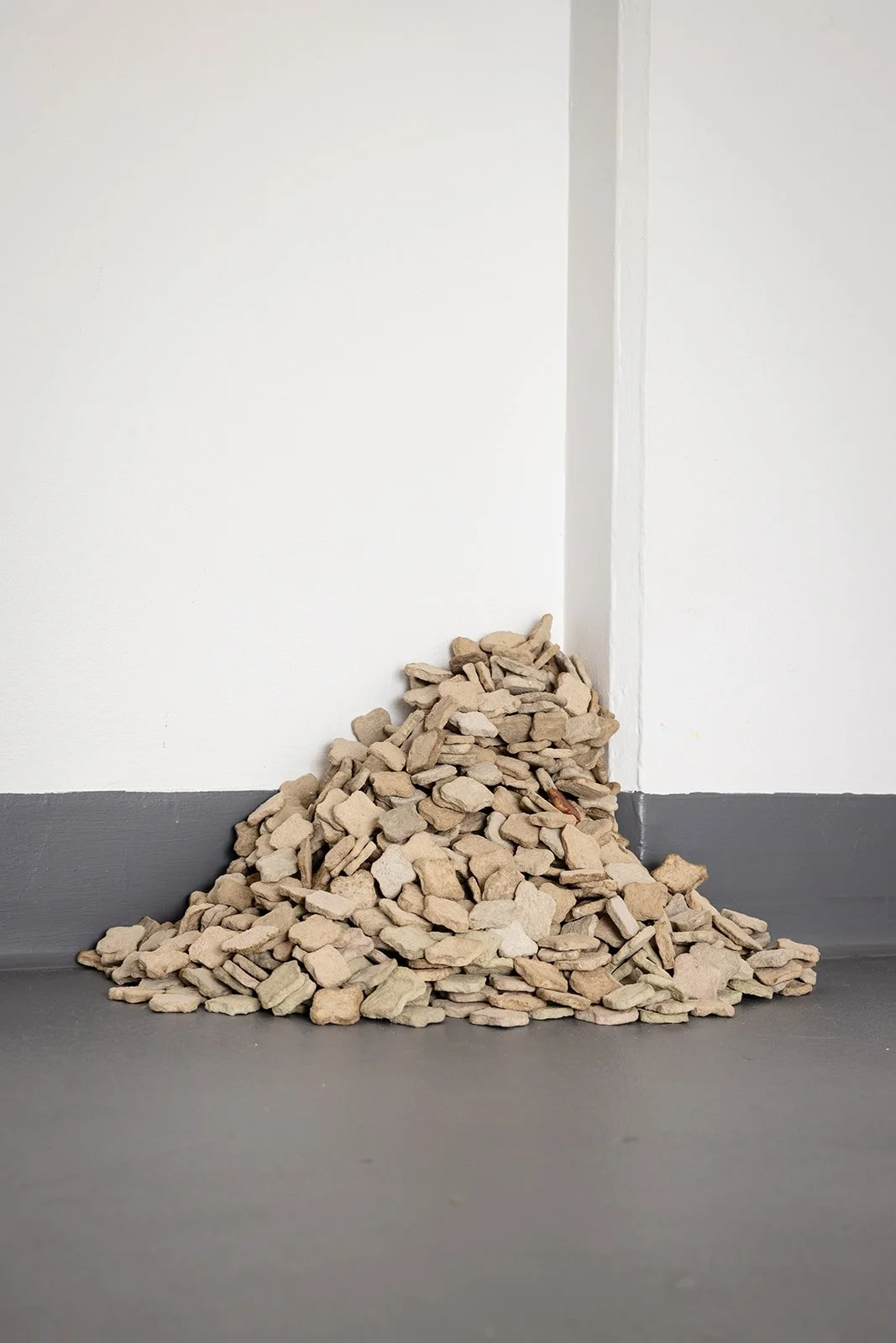 Photograph: Robyn Wood Images,
Installation View: Bathroom Tiles, 999 grey + 1  red handmade Paper Clay Tile.