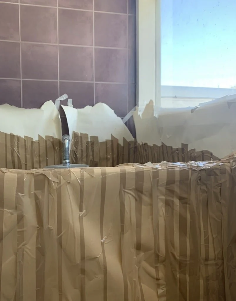 Bathroom Exoskeleton: Tape regularly features in Condon's works and is used as a method of mapping and tracing domestic spaces.