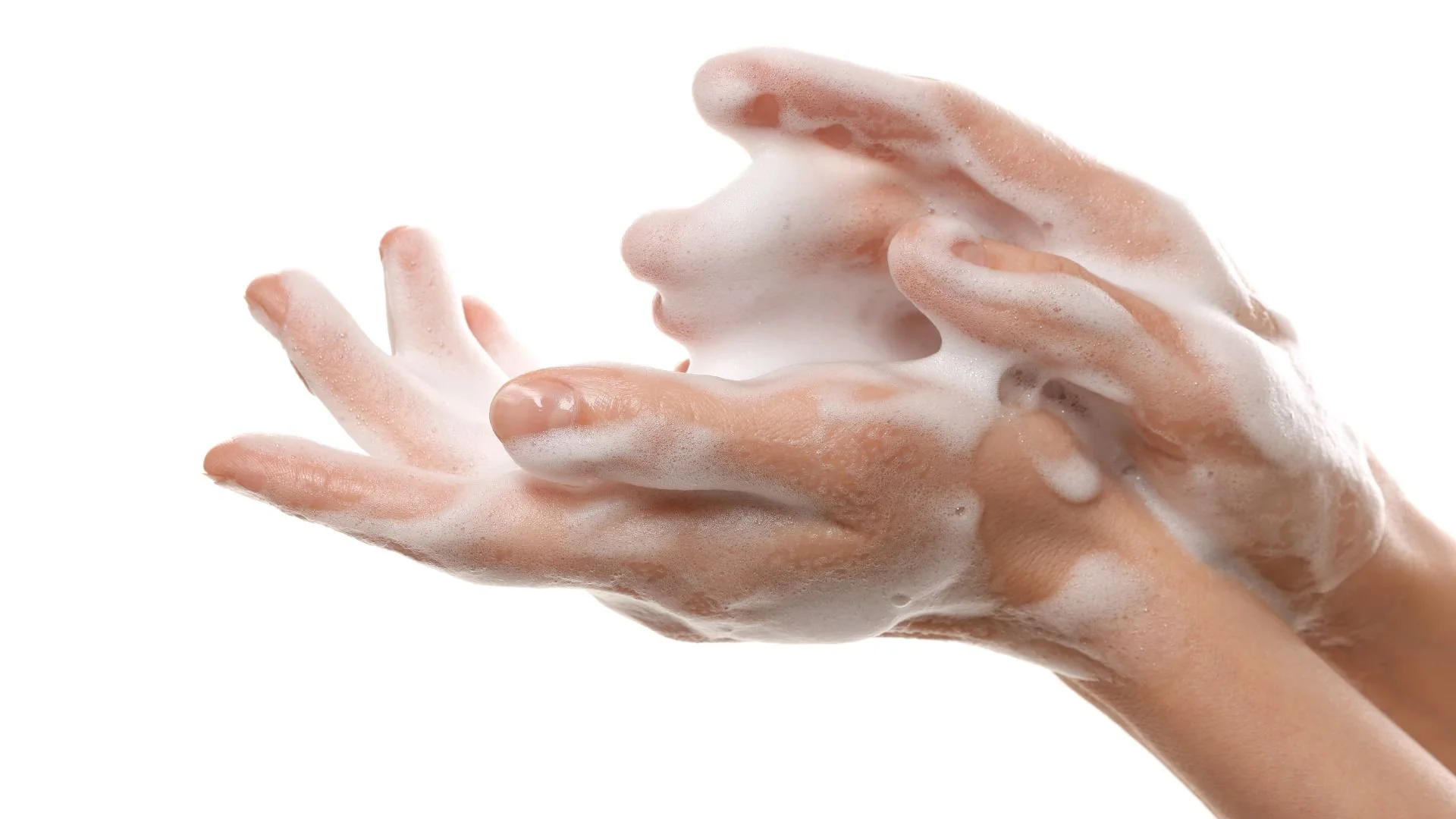 Hands lathered with soap, a small everyday moment of clean, gentle care.