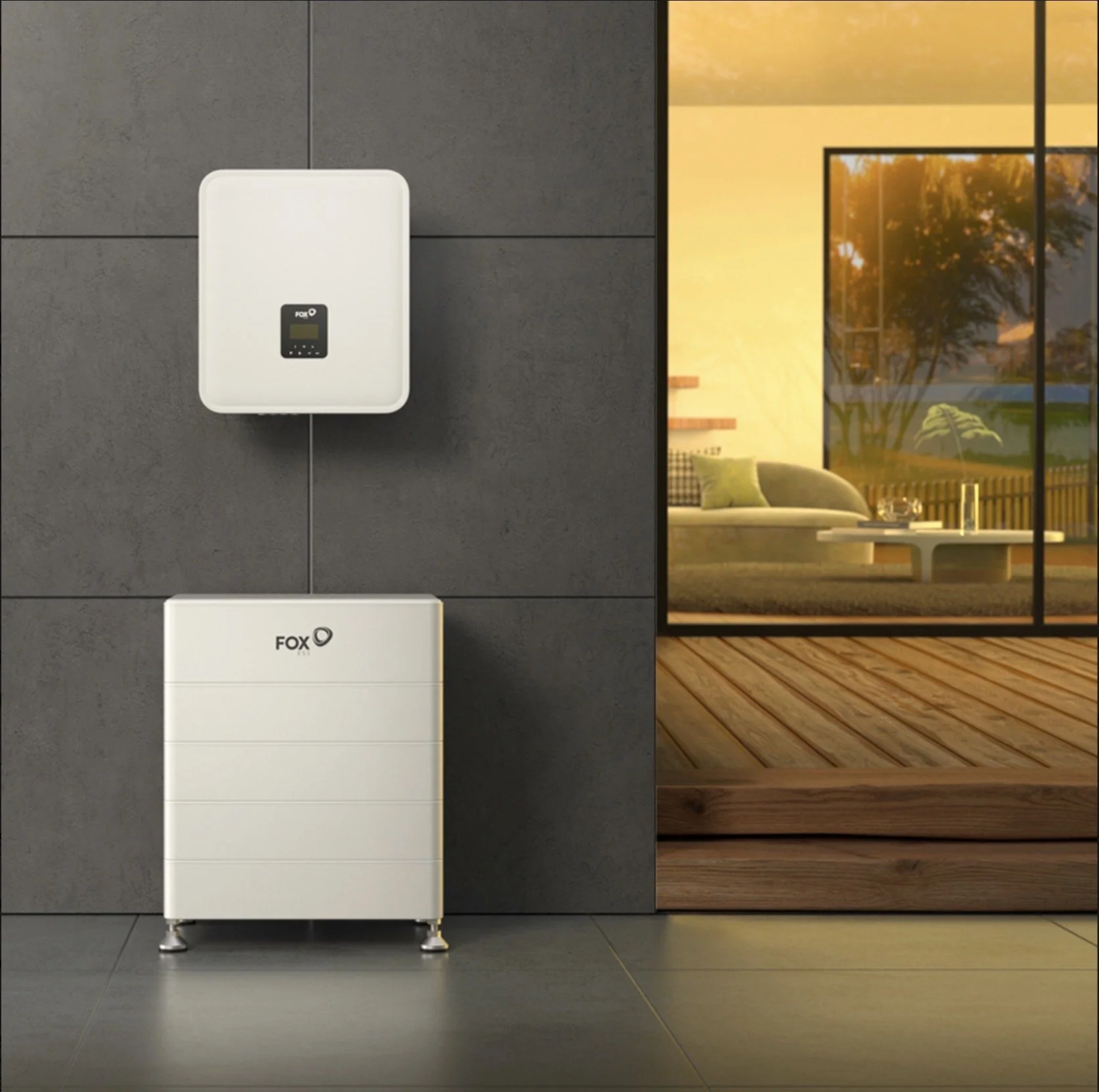 A white outdoor solar inverter and a white battery storage system with the brand name 'FOX' are mounted on a dark gray tiled wall outside a modern home. The scene is illuminated by warm sunlight with an interior view of a living room visible through a large glass window.