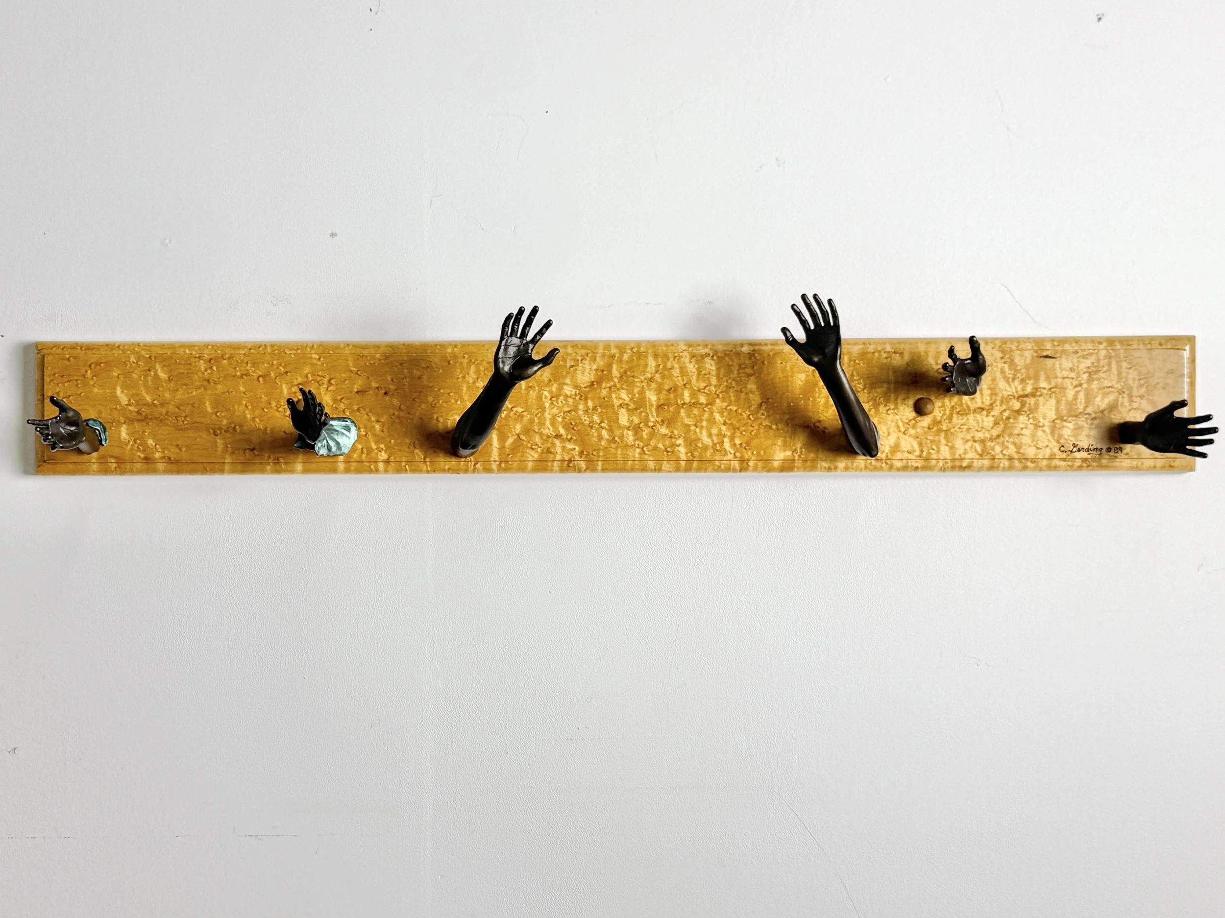 vintage mid century modern detroit michigan american studio craft birdsye maple wall mounted coat rack hook surrealist bronze hands wall hooks carl aubock unique rare vintage objects