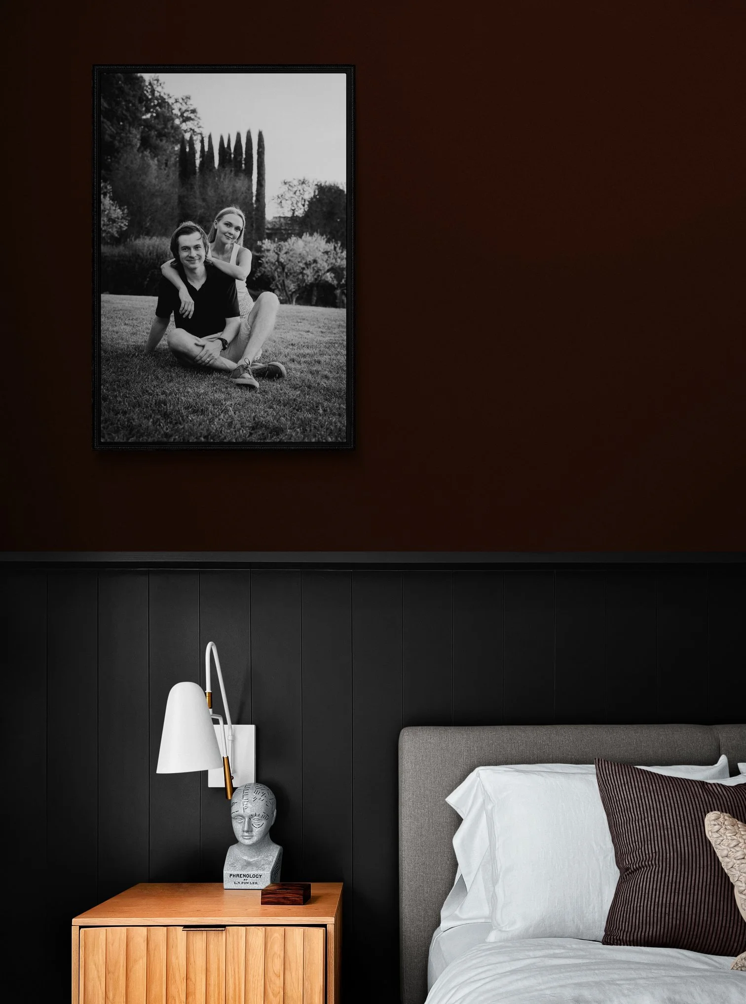 Couples portrait from Umbria vacation hangs above their bed