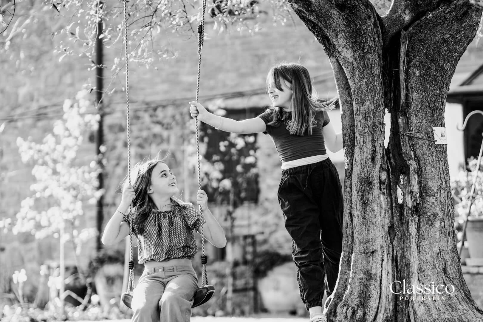 Two girls play during relaxed family photoshoot Mornington