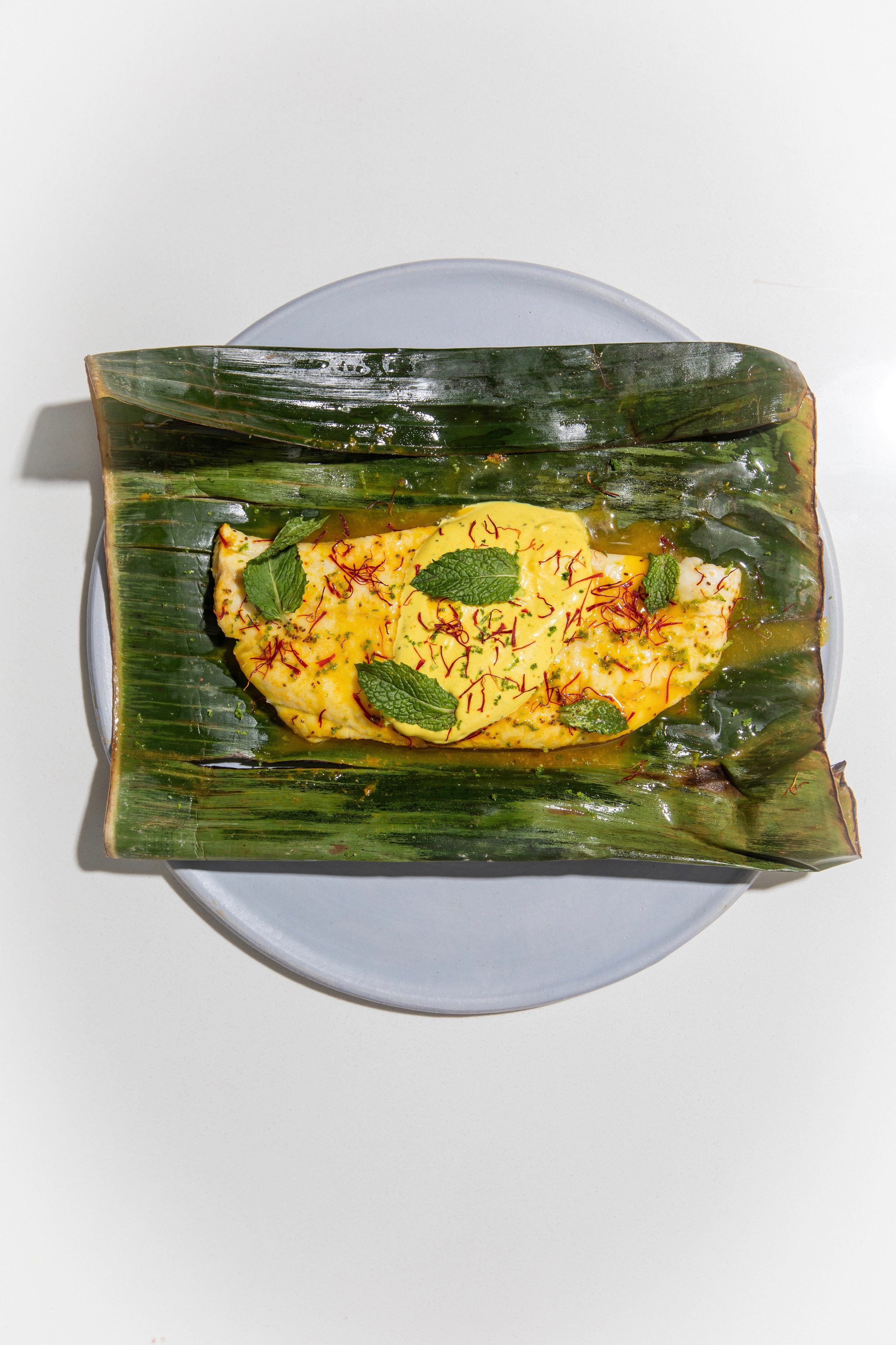 saffron fish in banana leaf.jpeg