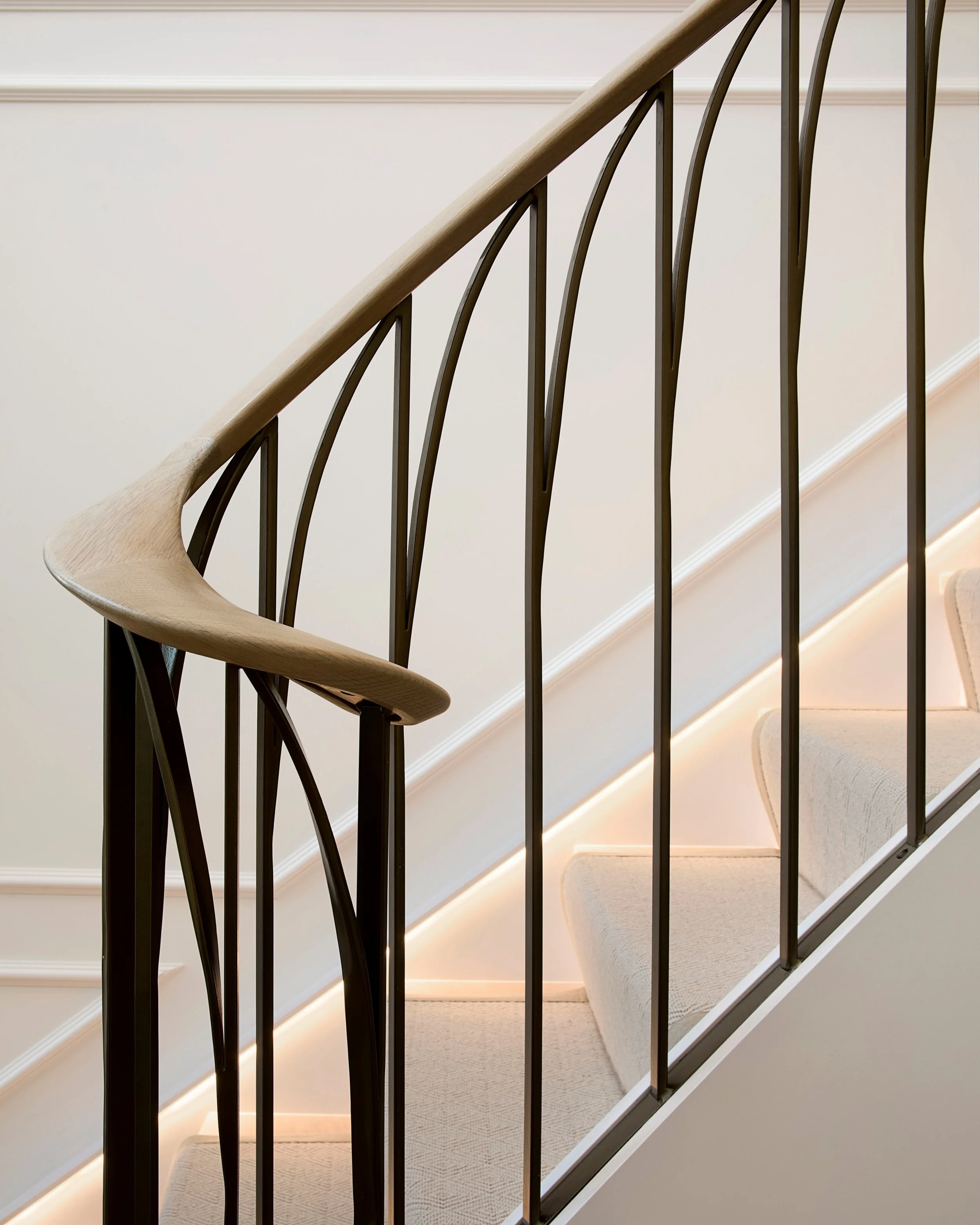 A well designed staircase can completely change how a home feels.

By opening up the balustrade and pairing bespoke steelwork with natural oak, we create a feature that improves light, adds character and compliments the wider interior rather than com