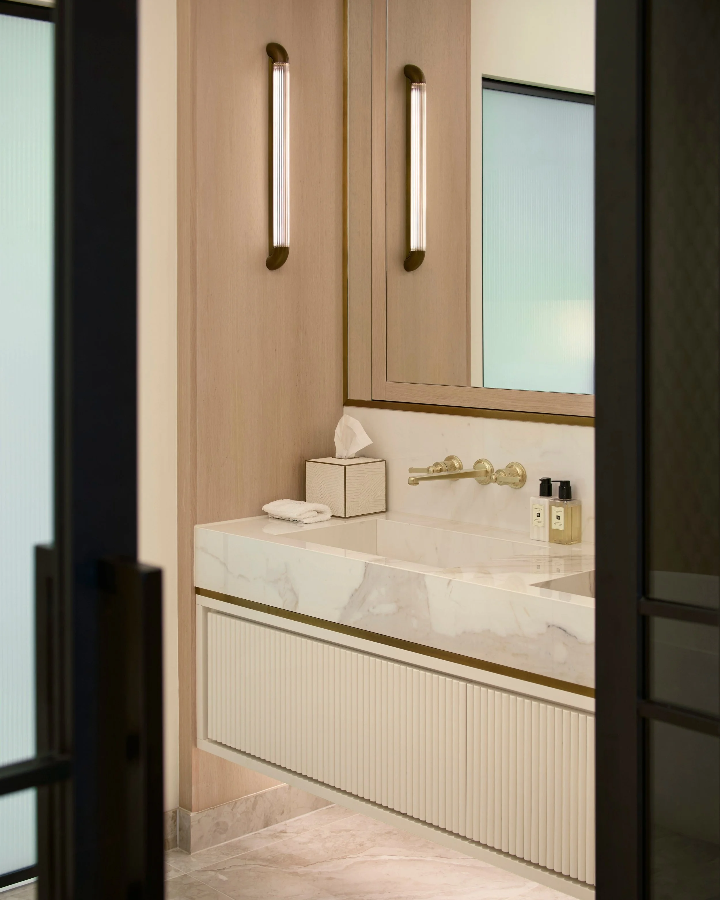 An extremely calming Master Suite space designed for a full turn-key home design. 

Our vanity elevation is framed by a light veneer surround to add importance to this functional zone within the space, supported by a duo of soft wall lights. 

As you