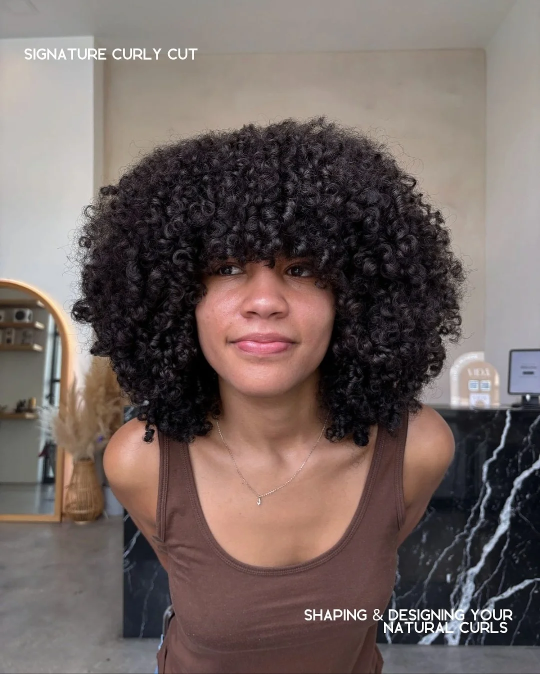 Curls deserve their moment ❤️&zwj;🔥 Our Signature Curly Cut is designed to enhance your natural texture and make every curl pop. Ready to book? @curls.byalo is your go-to x