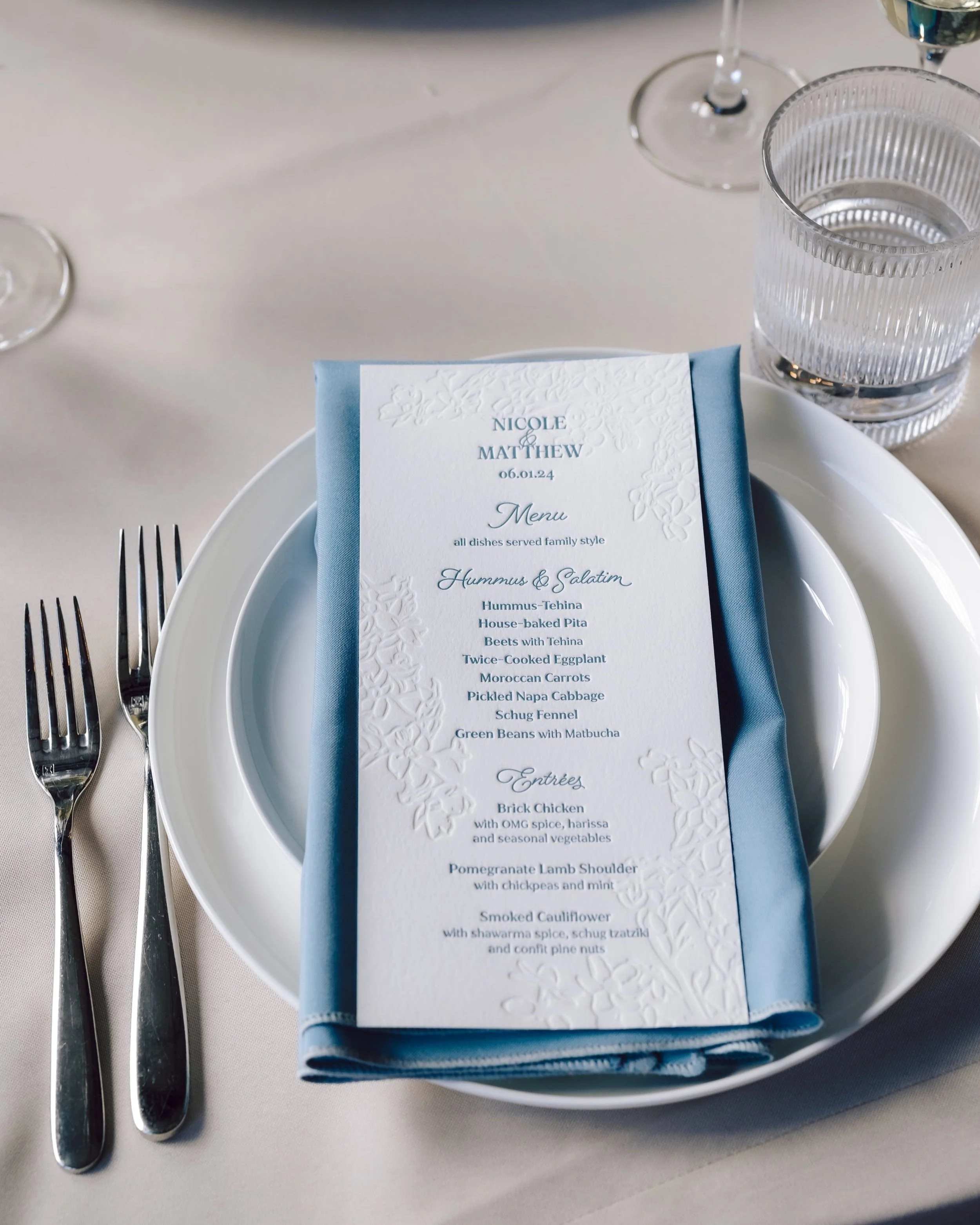 menu with blind letterpress and blue ink