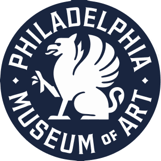 Logo of the Philadelphia Museum of Art featuring a white phoenix on a dark blue circular background with the text 'PHILADELPHIA MUSEUM OF ART'.