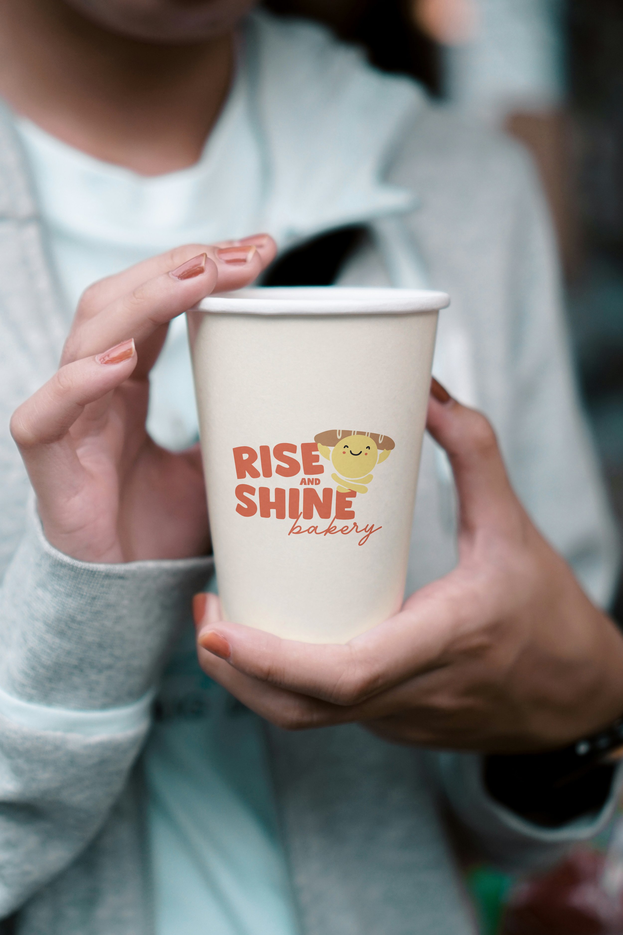 paper cup in hand mockup copy.jpg