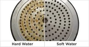 Shower head showing hard water on one side and soft water on the other