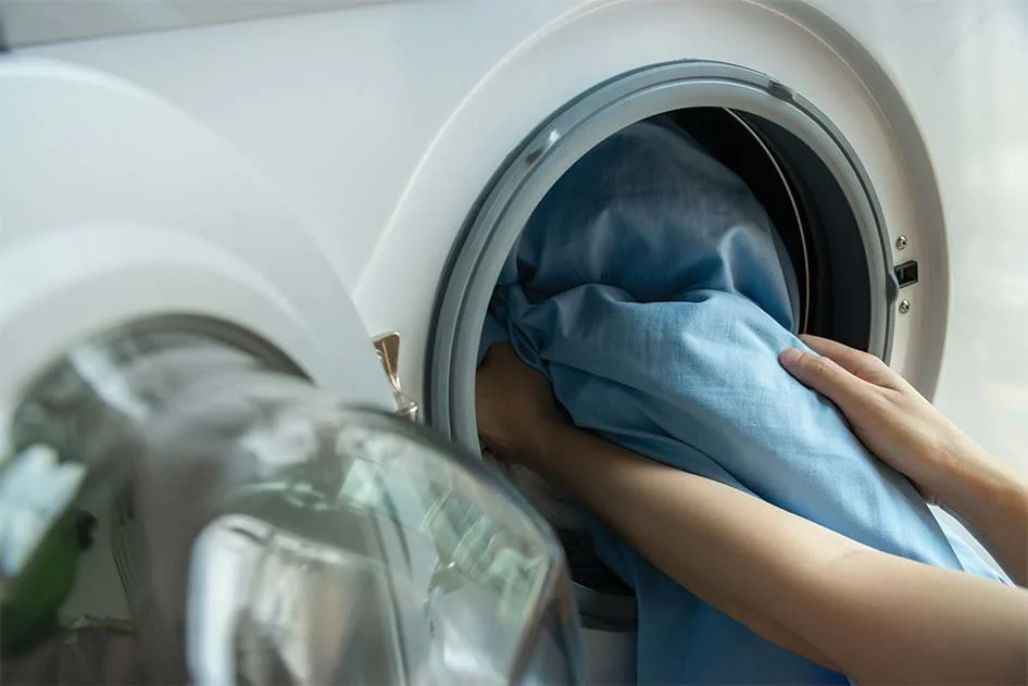Taking soft sheets out of the dryer