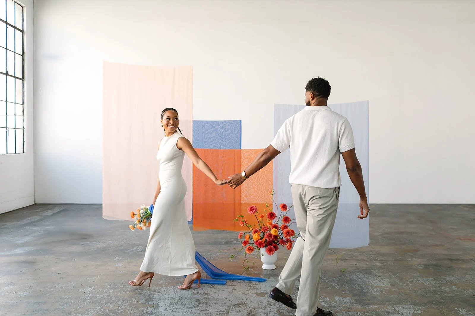 A bride and groom dance in their first pictures after wedding at Mica Studios