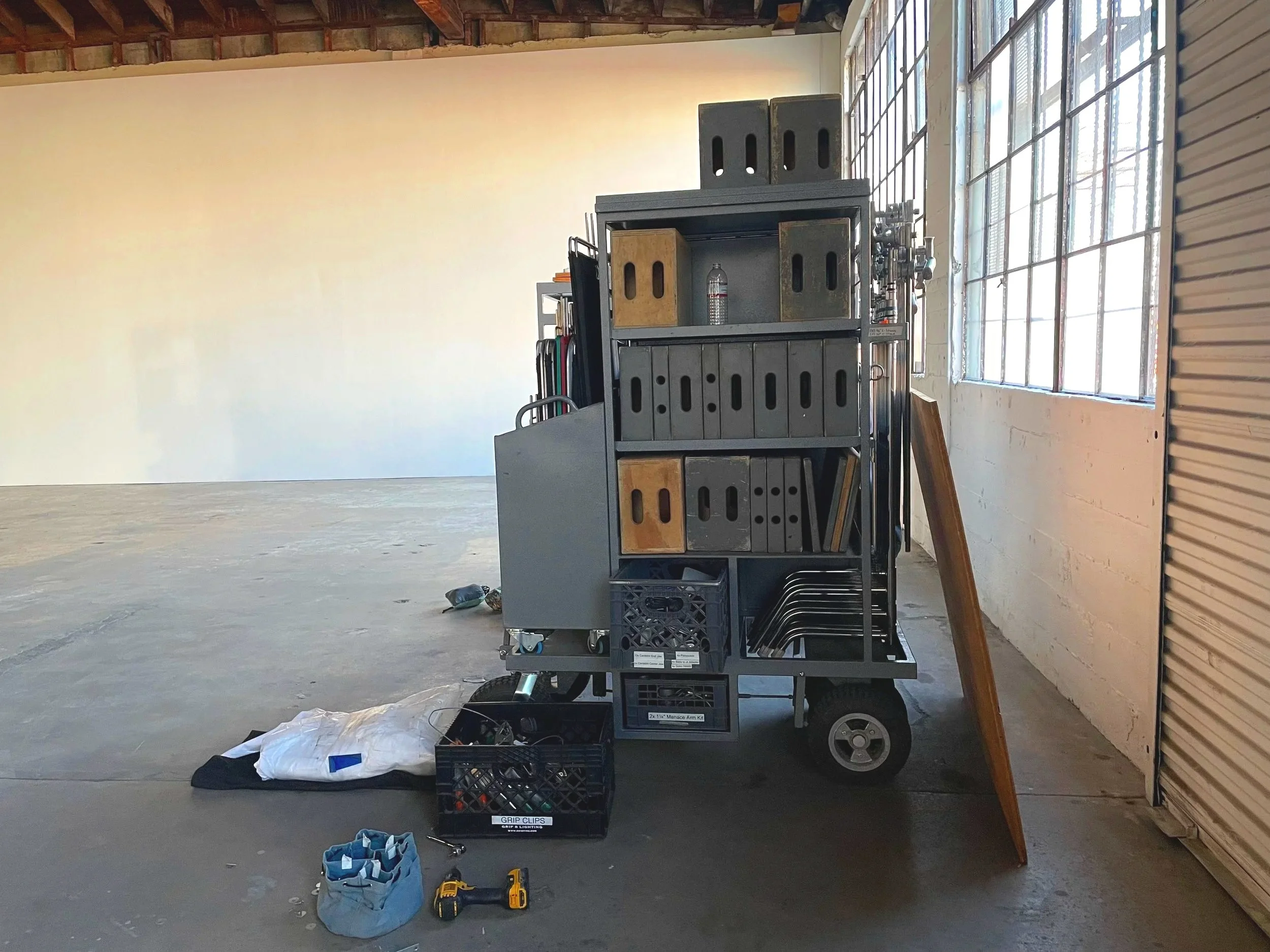 An equipment cart full of photography gear is captured before a shoot at Mica Studios