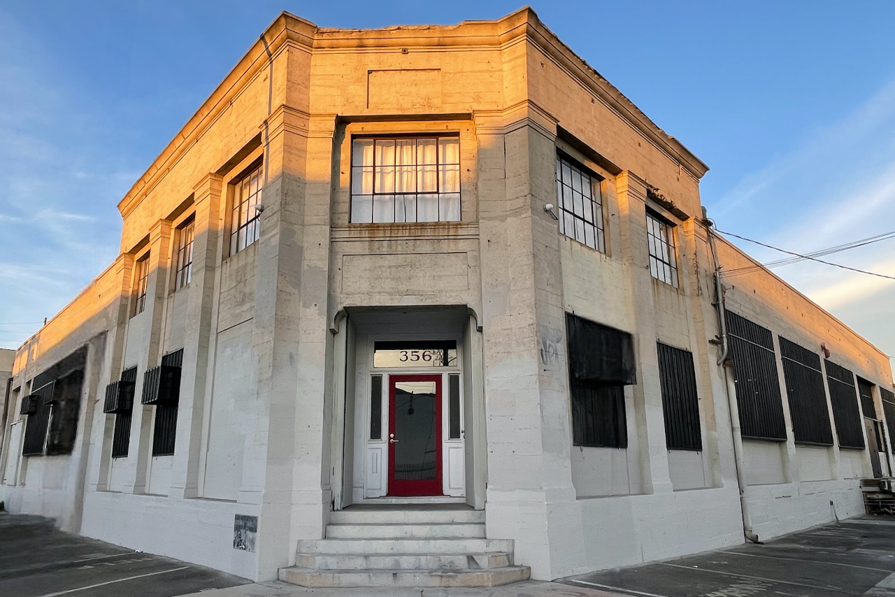 The entrance to the historic Mica Studios lit by sunset