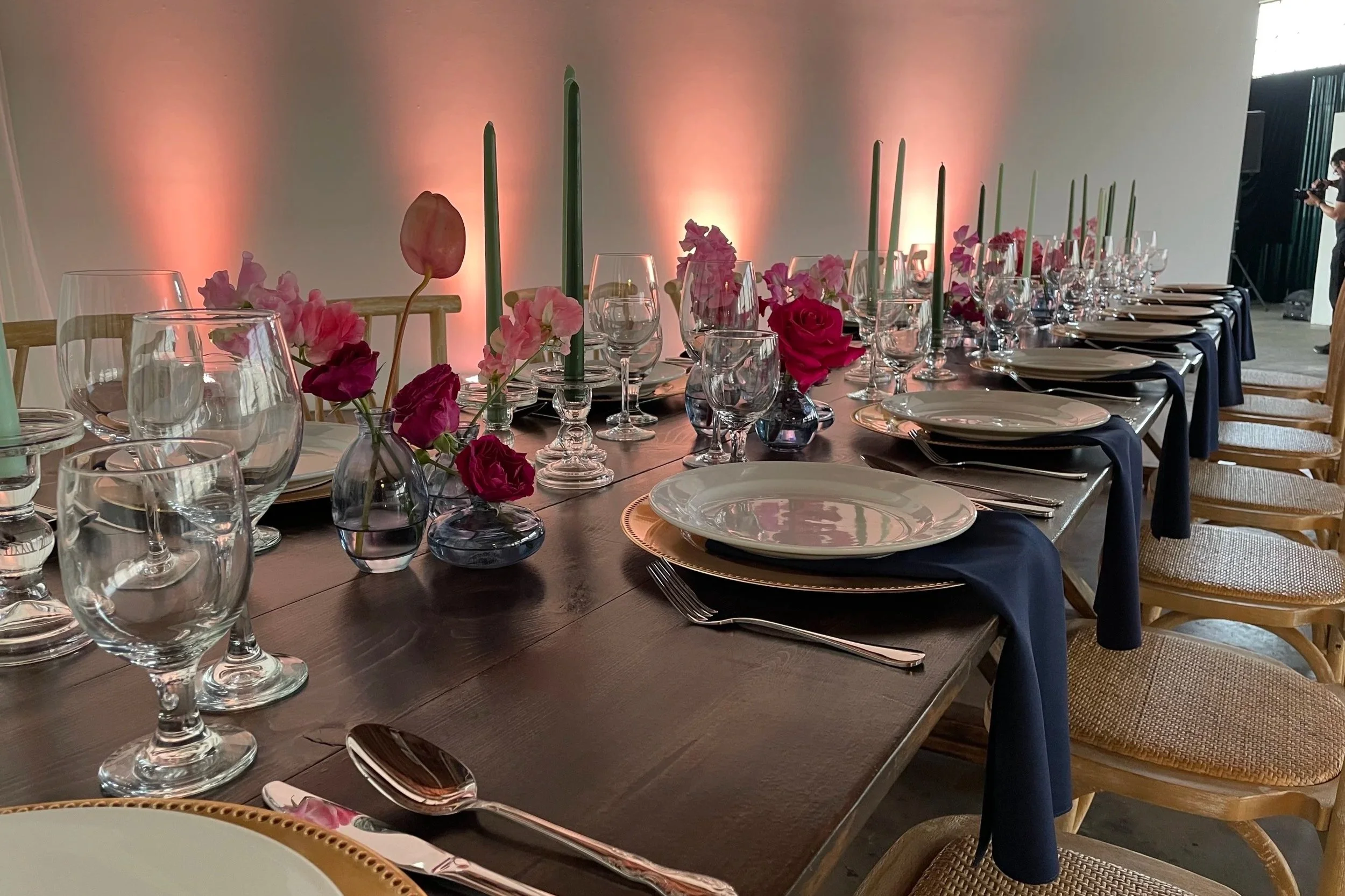 A dinner table set for guests at a wedding at Mica Studios in Los Angeles