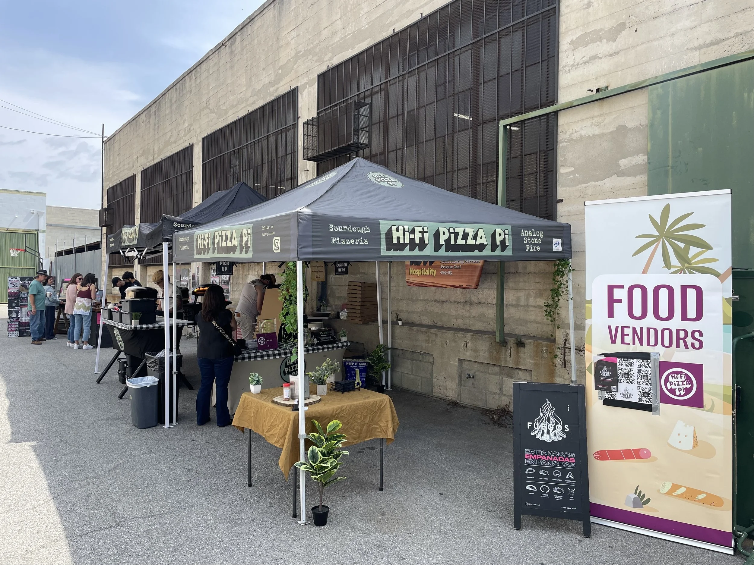 Multiple food vendors setup outdoors at Mica Studios