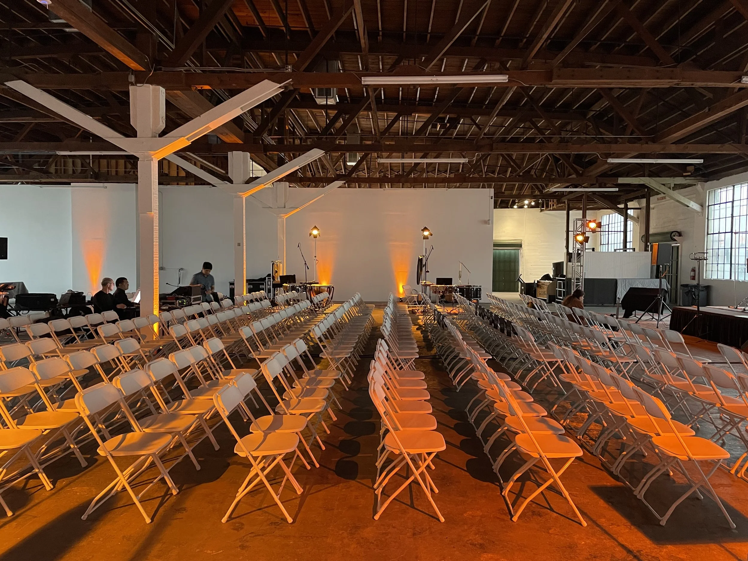 Collection of chairs set for guests ahead of a large concert performance