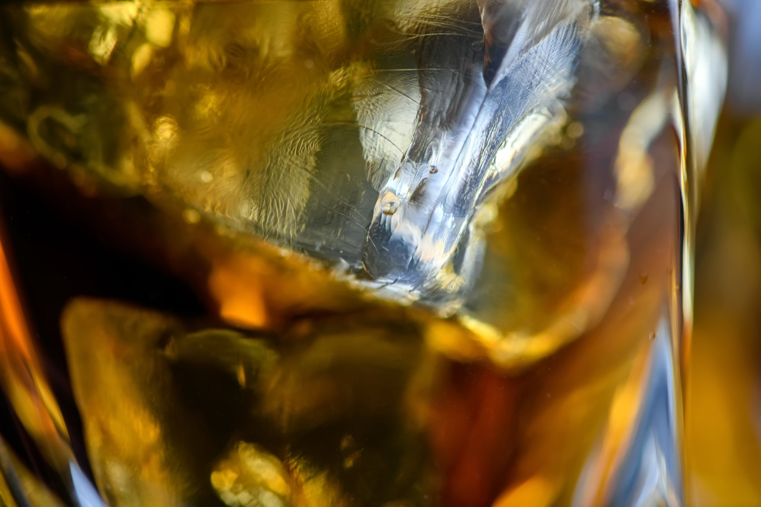 pieces-of-ice-cube-in-whiskey-close-up-macro-of-i-2023-11-27-04-57-16-utc.jpg