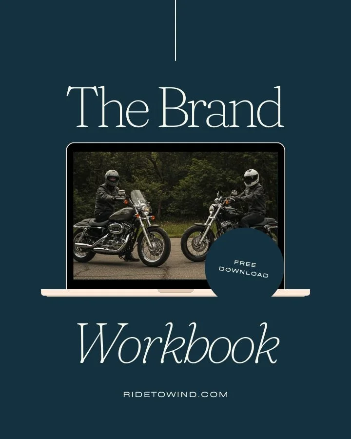 Design for a workbook titled 'The Brand Workbook' with a photo of two motorcyclists riding on a road, viewed through a laptop screen. Includes a round badge that says 'Free Download' and the website 'Ridetowind.com'.