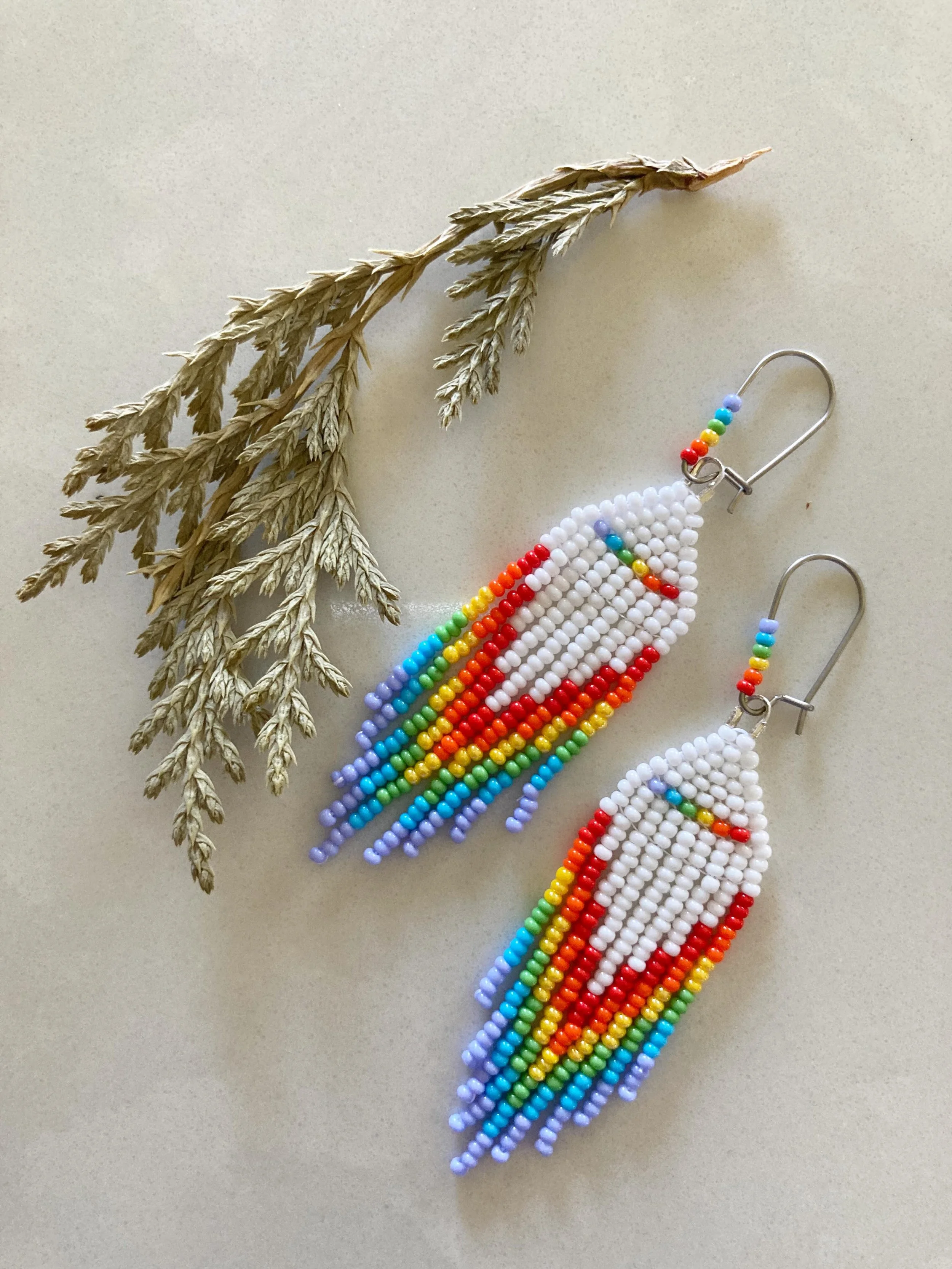 Dropping this here because June is both Pride Month and National Indigenous History Month in Canada.

Shout out to all my collectors who are either or both 🙌

#pridemonth #indigenoushistorymonth #beadedfringeearrings #rainbowearrings