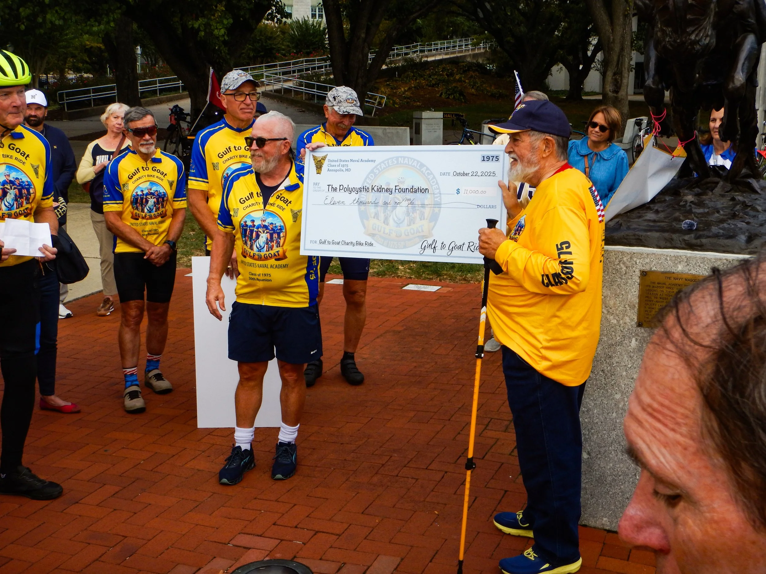 Mike Maynard presents check to Andy Howard for the Polycystic Kidney Foundation (PKD) Foundation