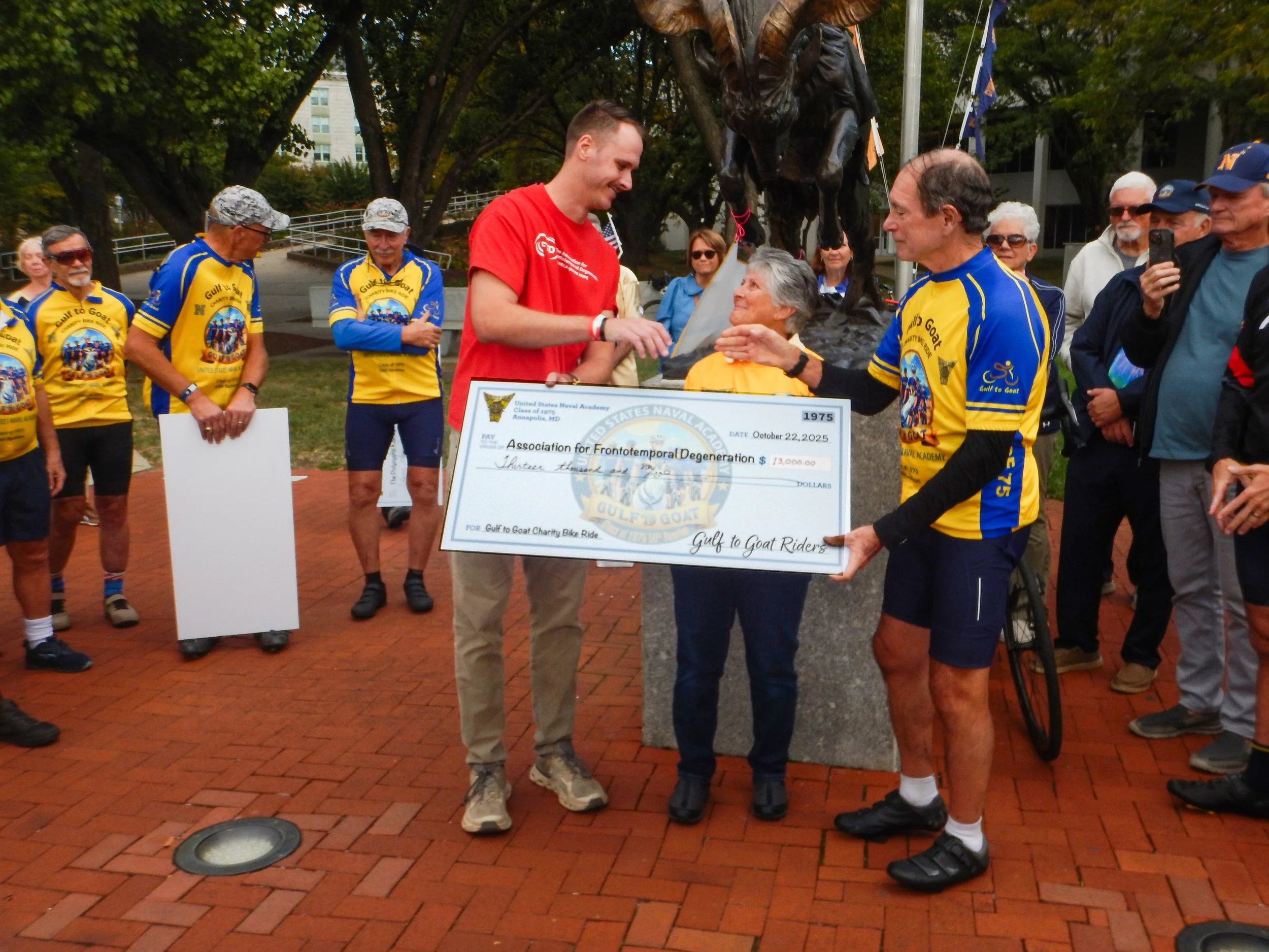 Jay Donnelly and Denise Lindner present check to Spencer Cline of the Association for Frontotemporal Degeneration (AFTD)