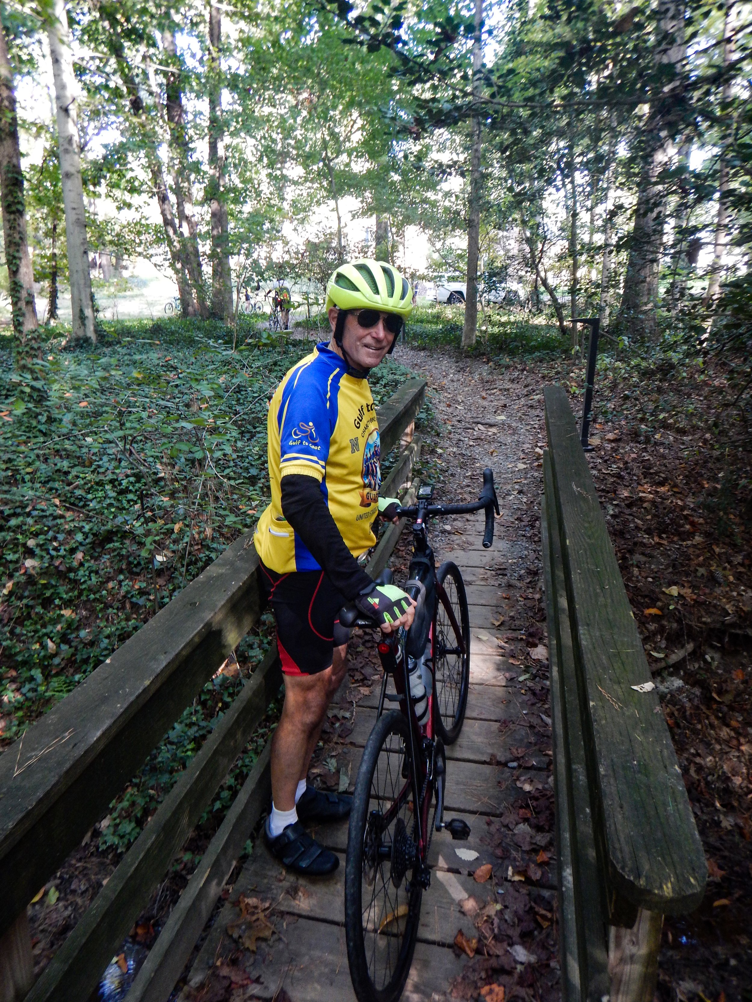 Jay walking bike on gravel trail