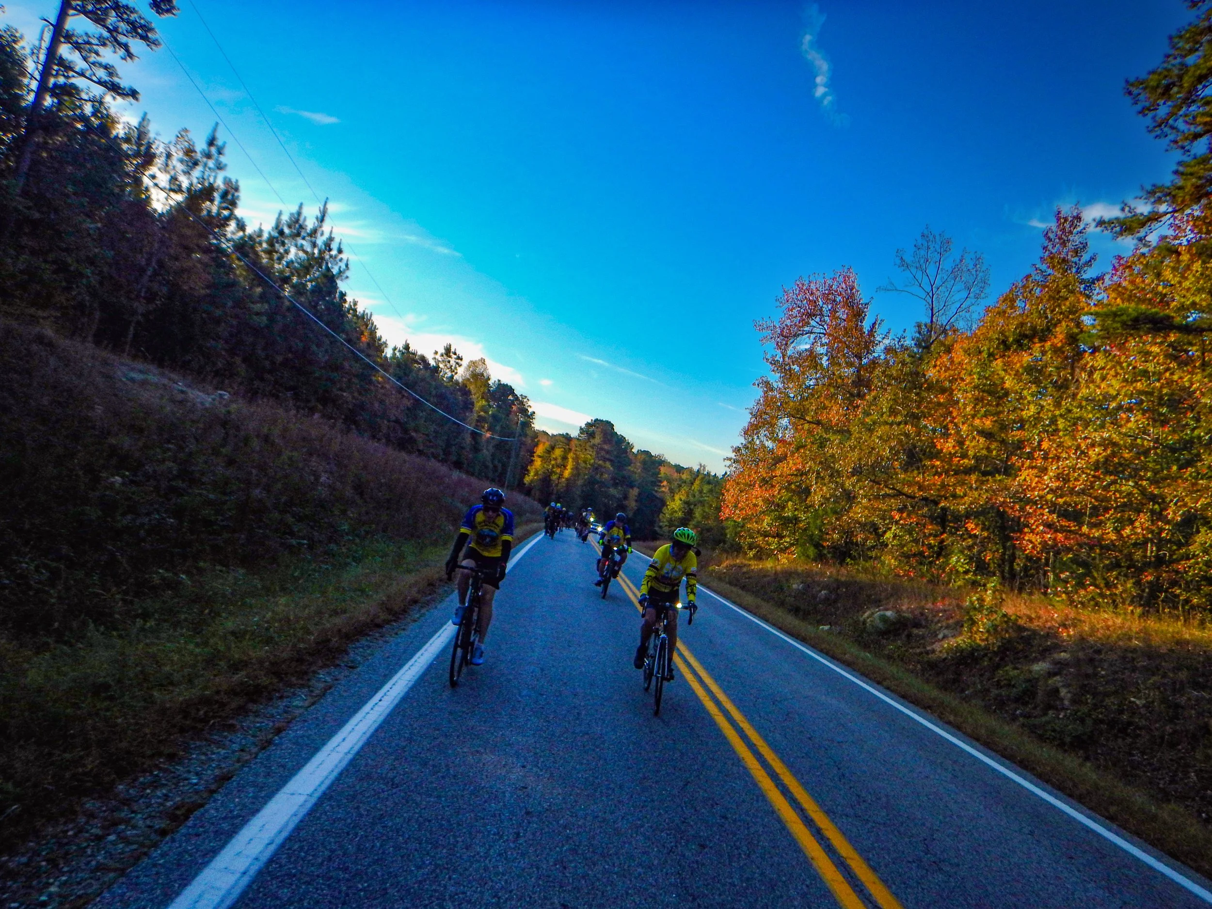 Riding in pairs behind police escort