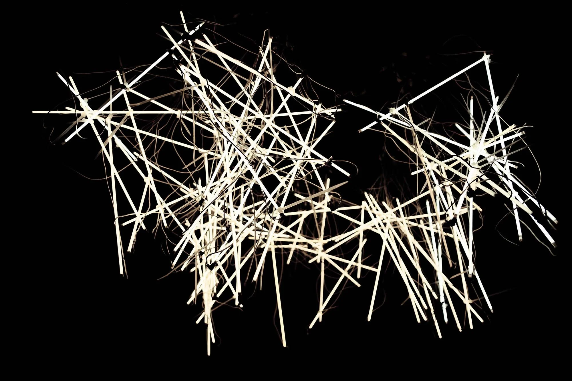 Experimental lighting fixture with artistic form, dynamic illumination, and modern sculptural design for creative interiors