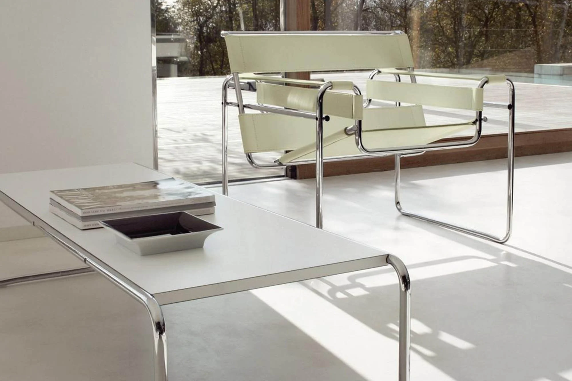 Modern white Wassily Chair with chrome frame, Bauhaus-style accent seating for minimalist or contemporary interiors.