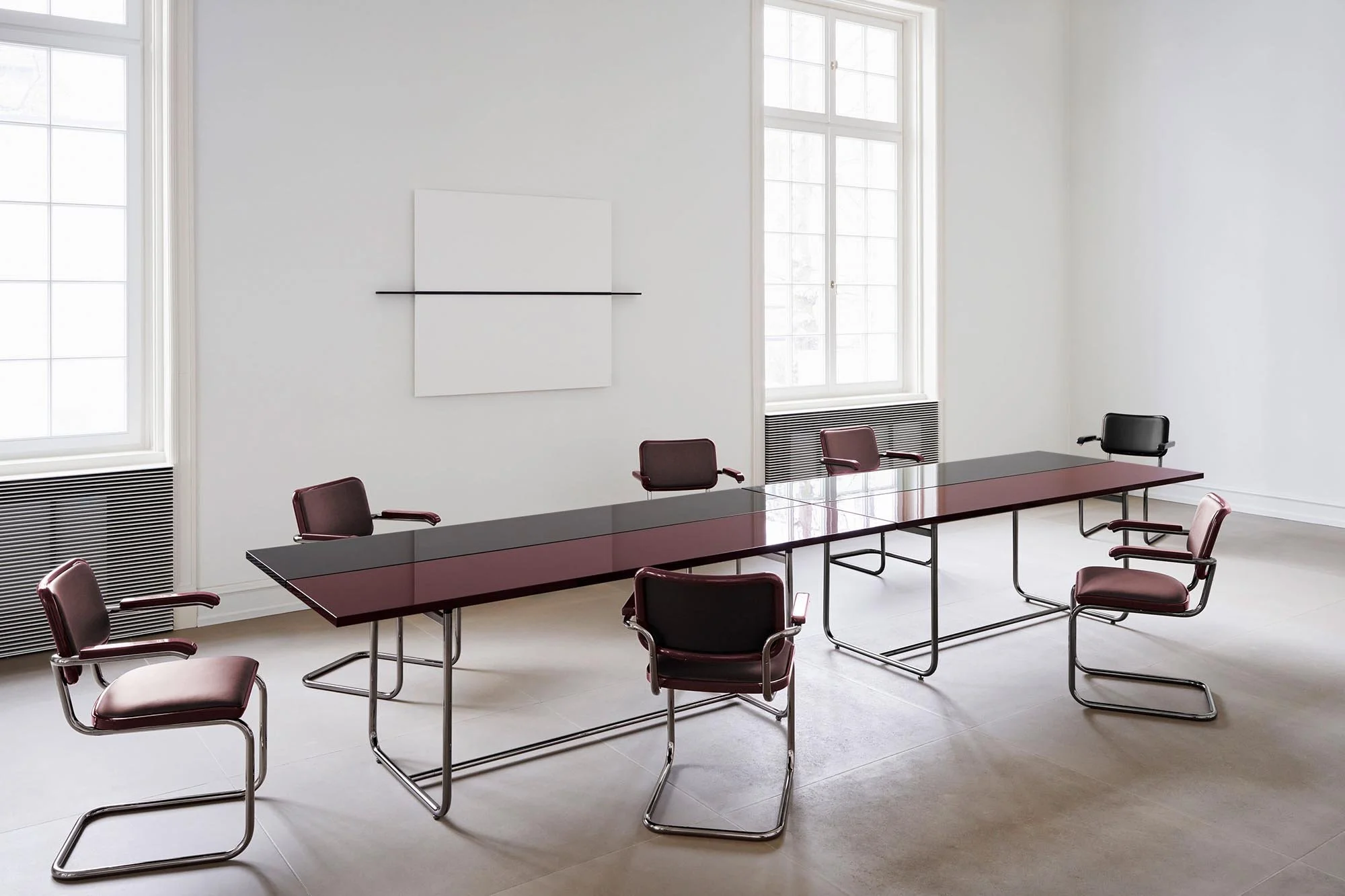 JS . THONET S 1070 table in a two-tone high-gloss finish with tubular-steel seating.