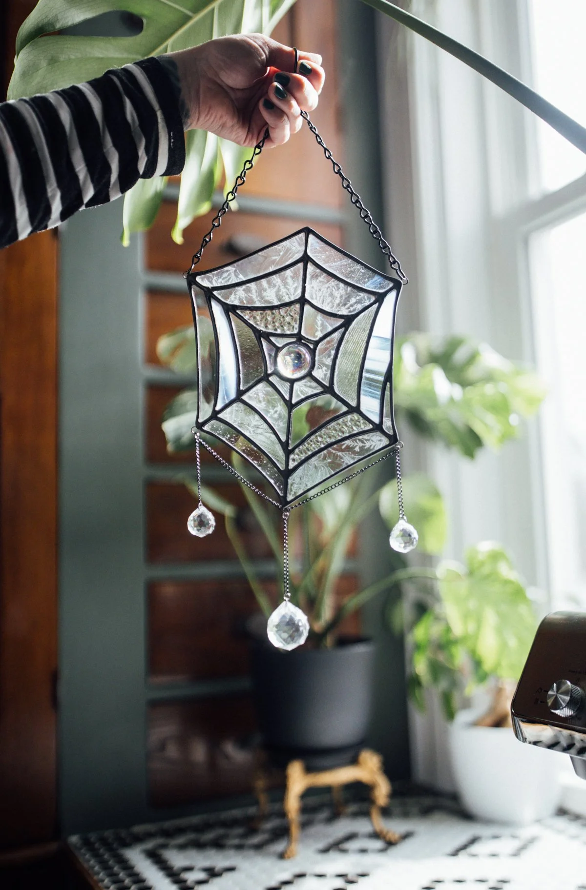 Stained glass spider web with gems