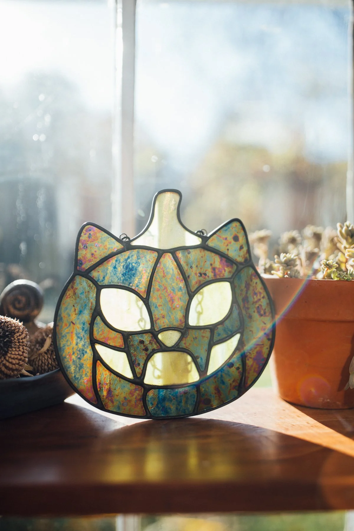iridescent green cat-o-lantern