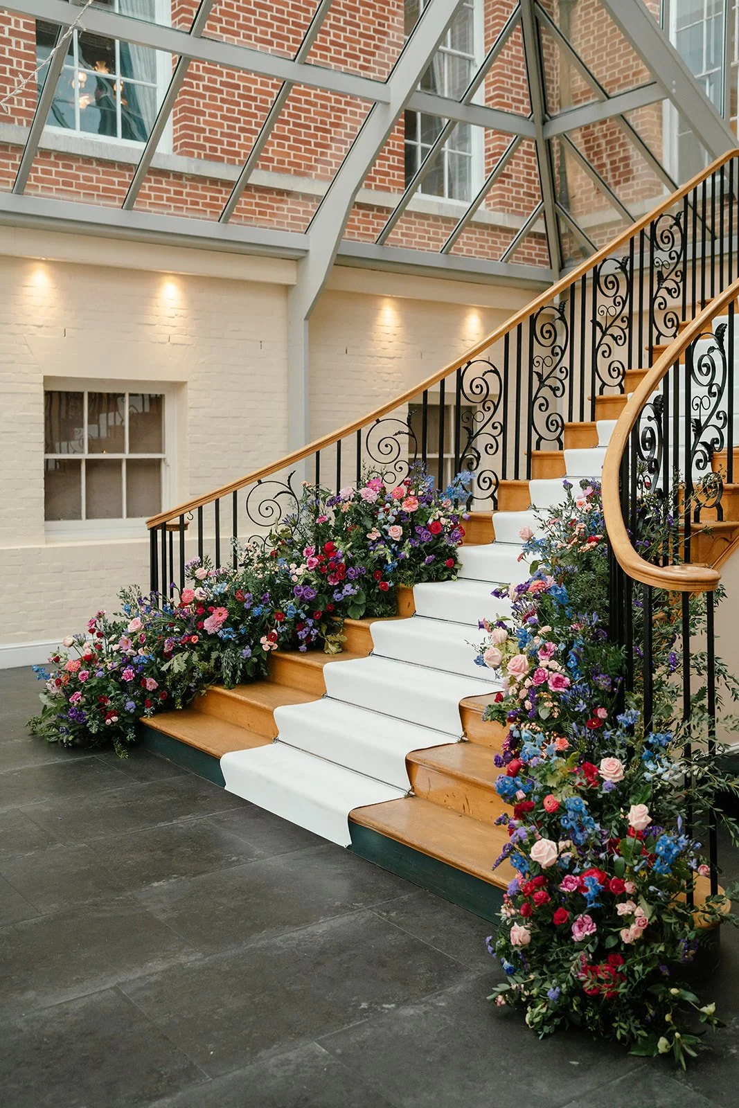 bold-colourful-wedding-flower-design-staircase.jpg