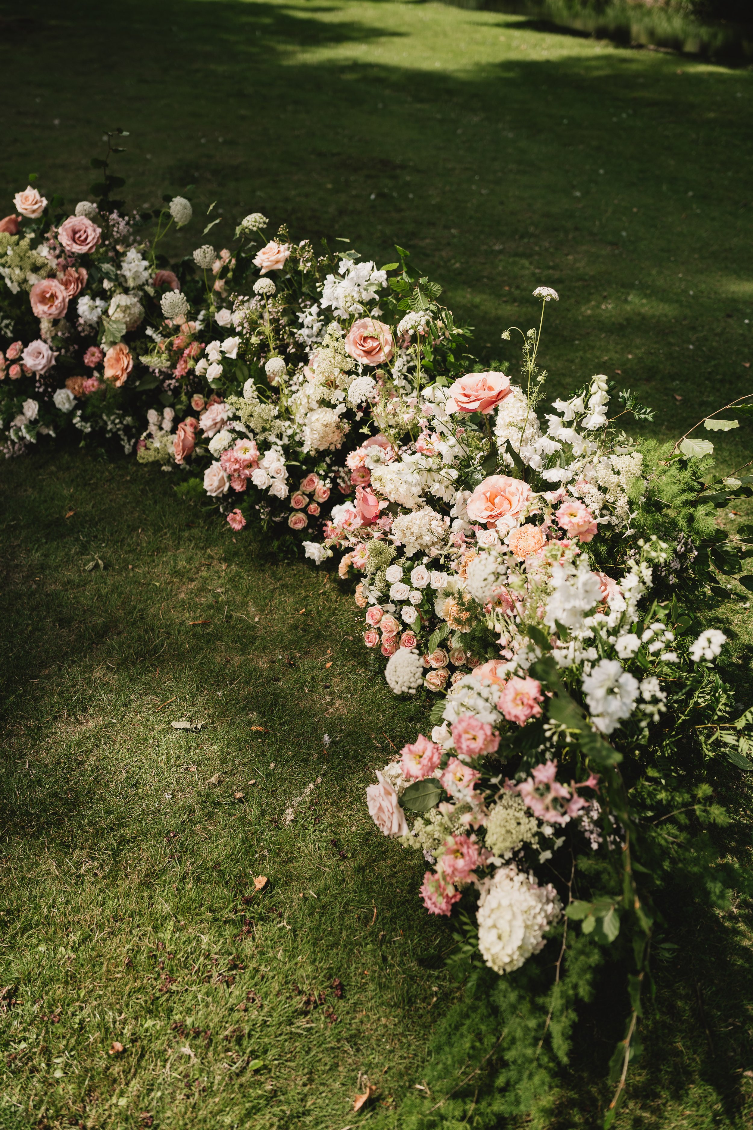 outdoor-wedding-ceremony-flowers-avington-park-hampshire.jpg