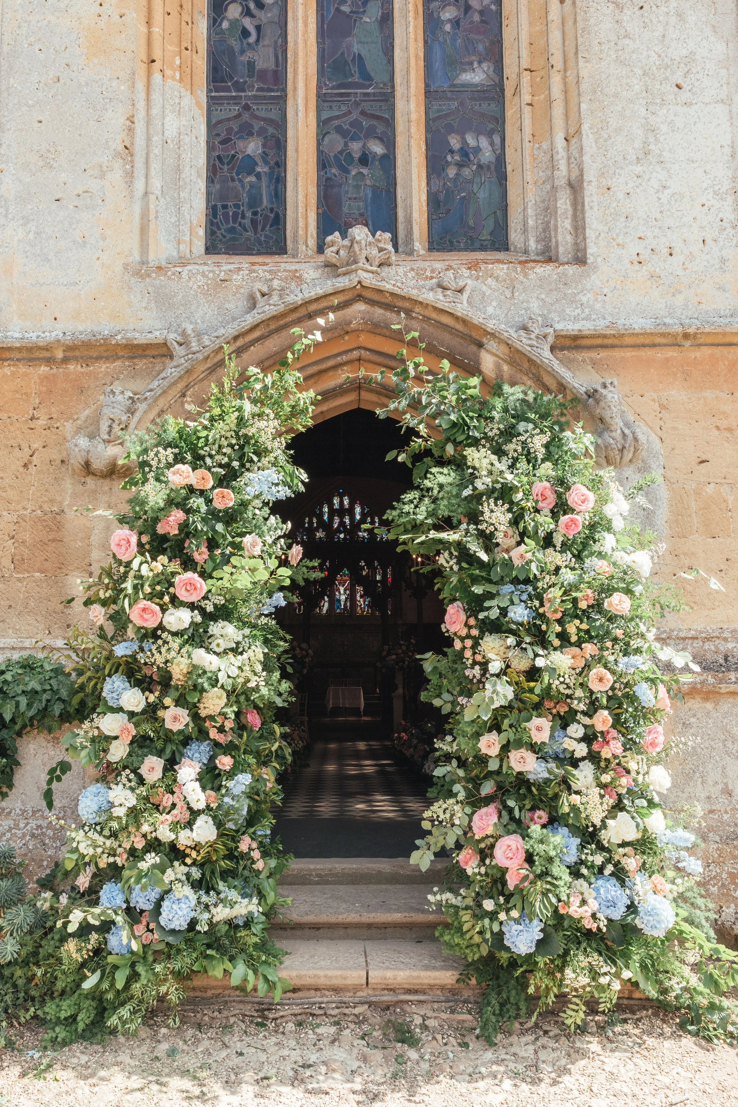 beautiful-pastel-wedding-floral-arch-sudeley-castle-cotswolds.jpg